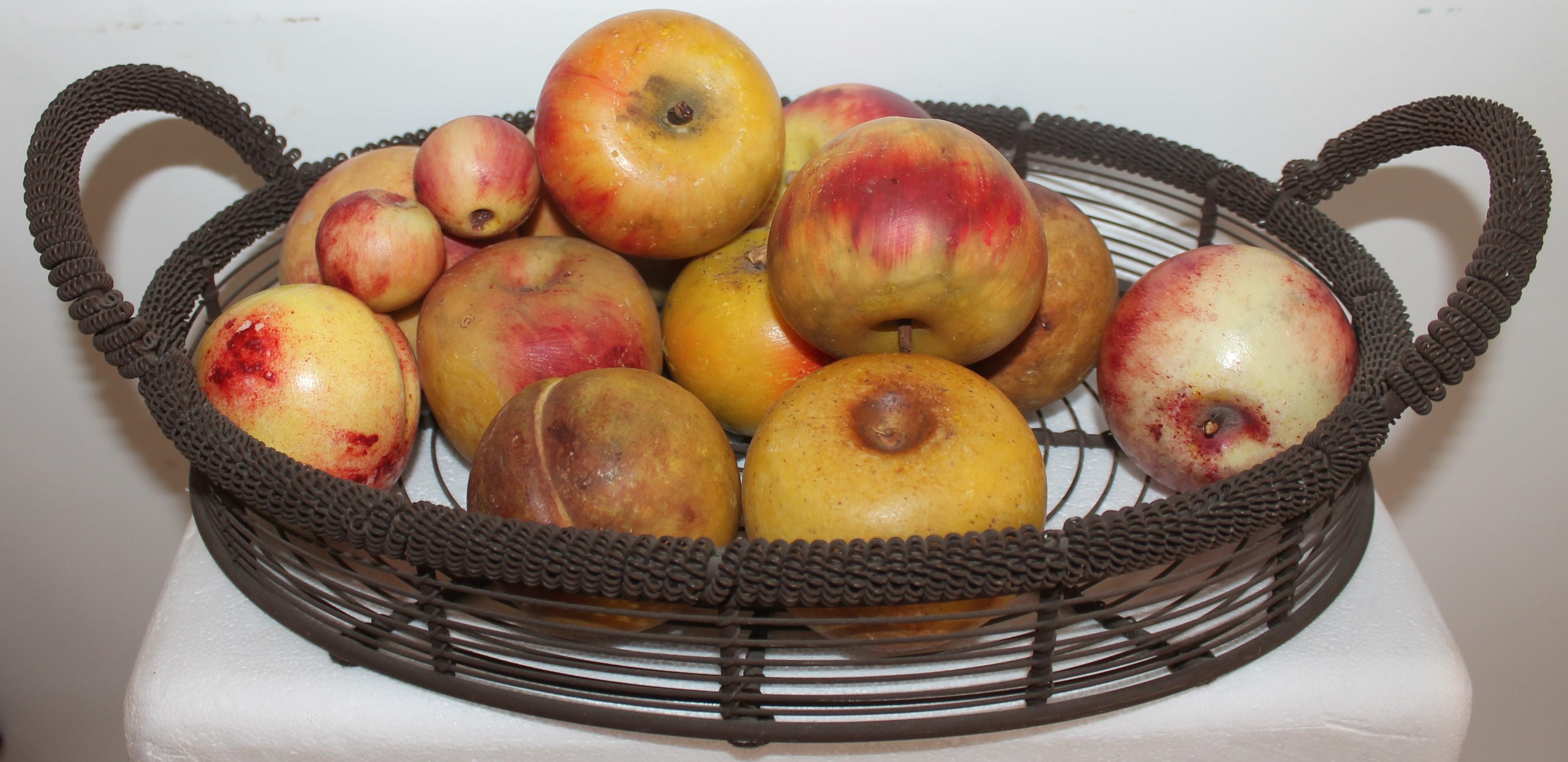 This amazing 19thc wire basket filled with 12 big apples & two little crab apples. With the basket there is a total of 15 pieces. Some are marked made in Italy.