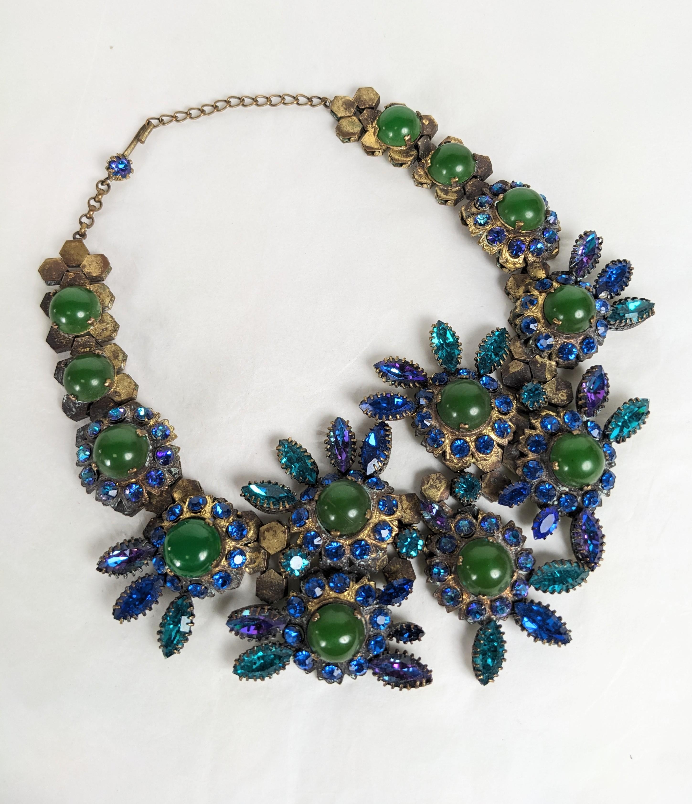 Amazing Countess CIS Elaborate Jeweled Collar from the 1950's France. Rare signed large model with a flexible hexagonal brass link base which is covered with settings of vari toned crystals in iridescent blue, purple, teal with faux jade cabochons.