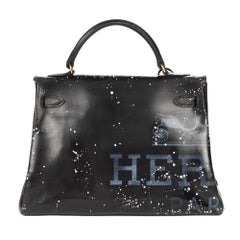 Amazing creation "Audrey Hepburn#47" on Kelly 32 cm handbag in black calfskin