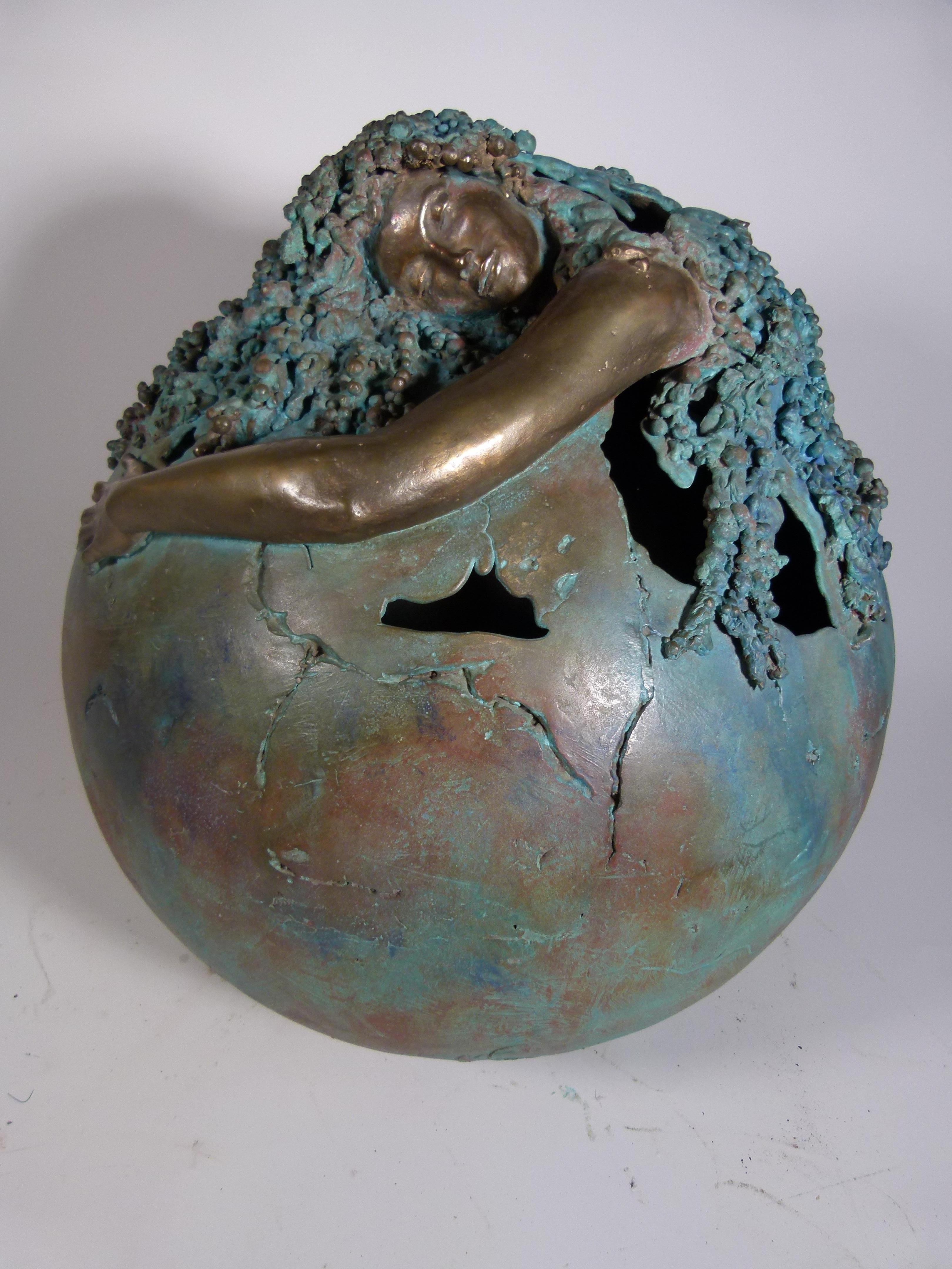 Amazing sculpture from Jean-Jaques Argueyrolles, representing a women embracing and protecting the earth. Her hair makes us remember the ocean, unifying her and earth in one.
One could interpret this sculpture as a symbol of our Mother Earth that