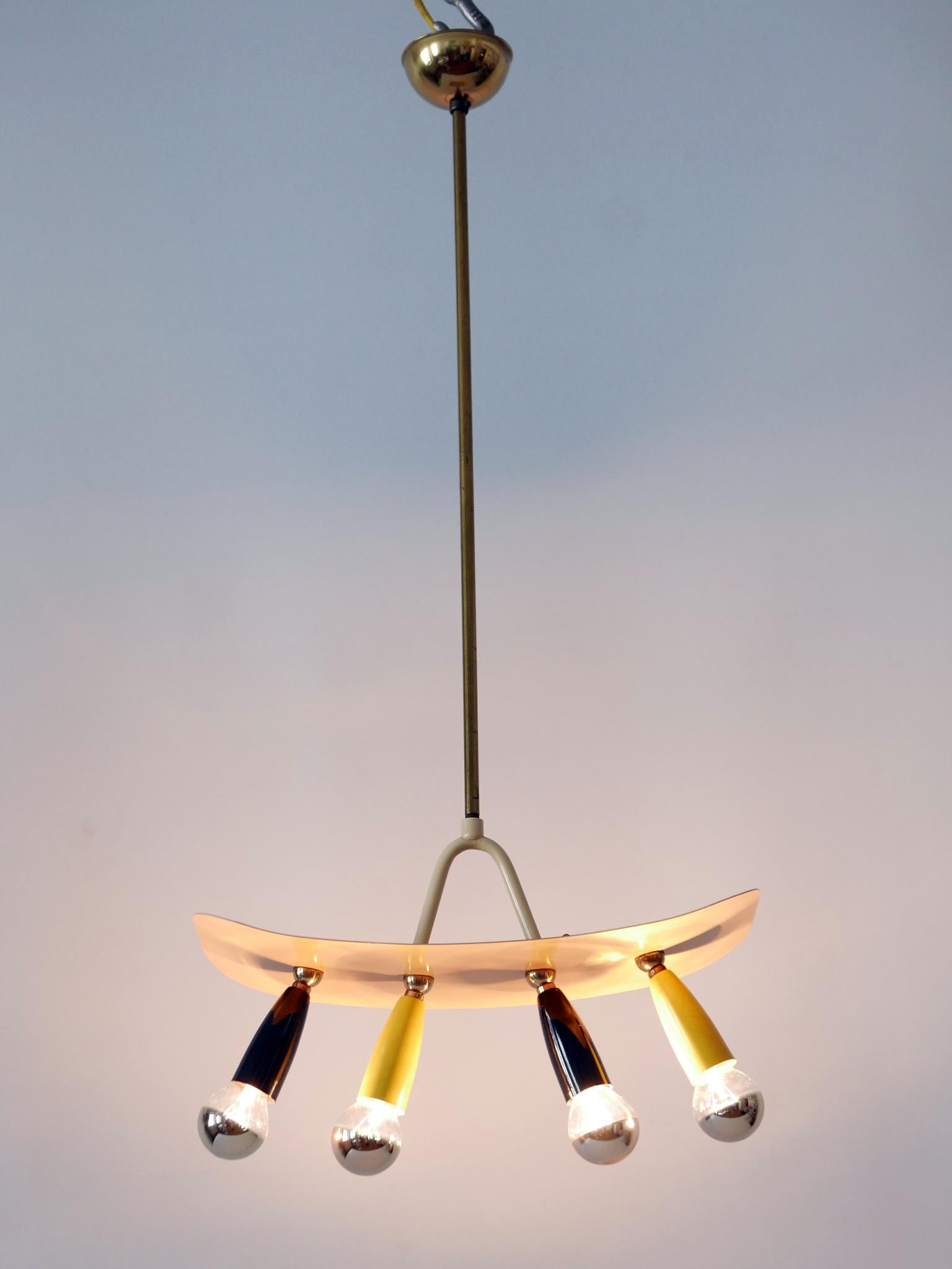 Amazing Mid Century Modern four-flamed sputnik pendant lamp. Designed & manufactured in Germany, 1950s.

Executed in brass & metal, the pendant lamp is executed with 4 x E14 / E12 Edison screw fit bulb sockets, wired and in working condition. It