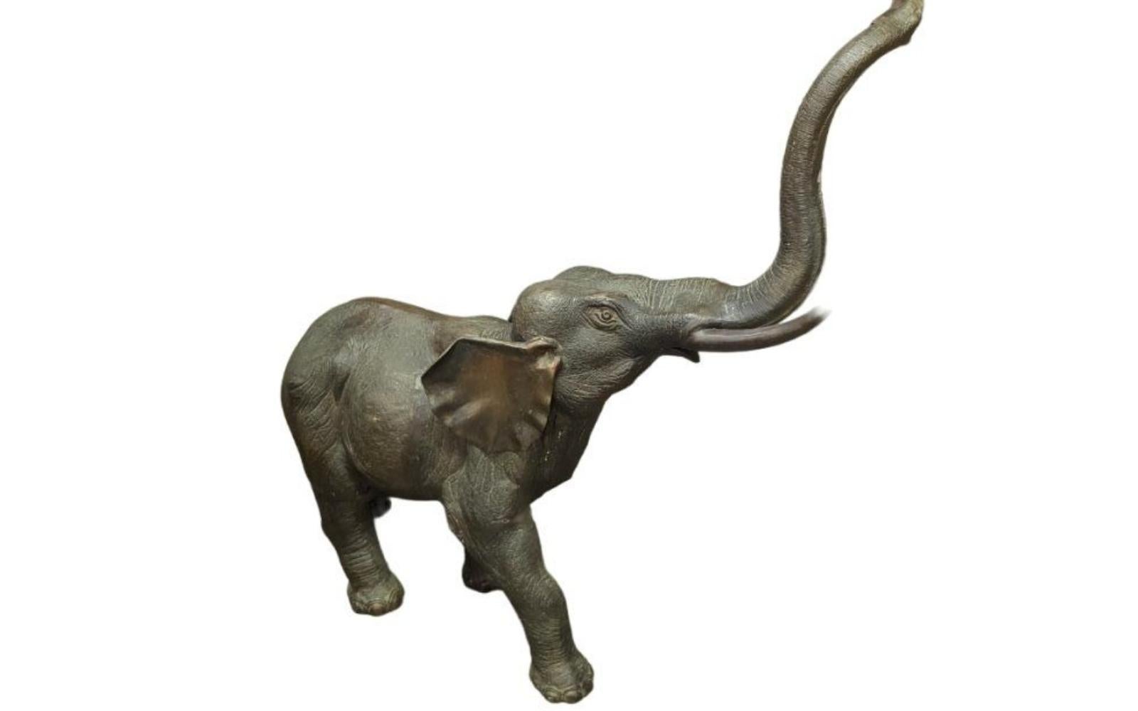 Very unique and large bronze elephant sculpture. It is very skillfully done with a lot of nice details. A great accent piece for any room.  Height: 47.25 in, Length: 15 in, Width: 44 in, Base Length: 15 in, Base Width: 30 in