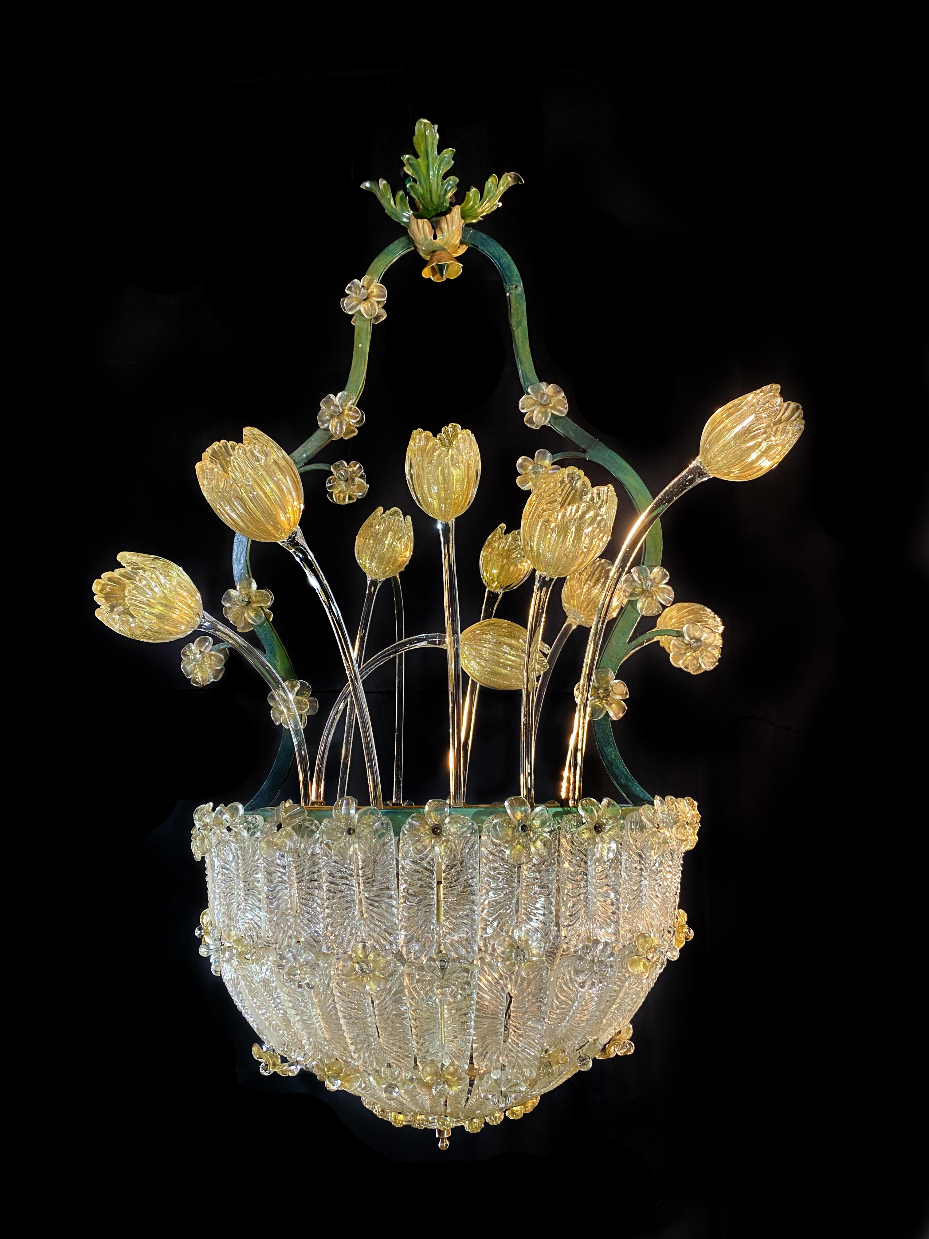 Incredibly beautiful chandelier attributed to the renowned Barovier & Toso. A helmet of glasses adorned with roses and golden tulips.