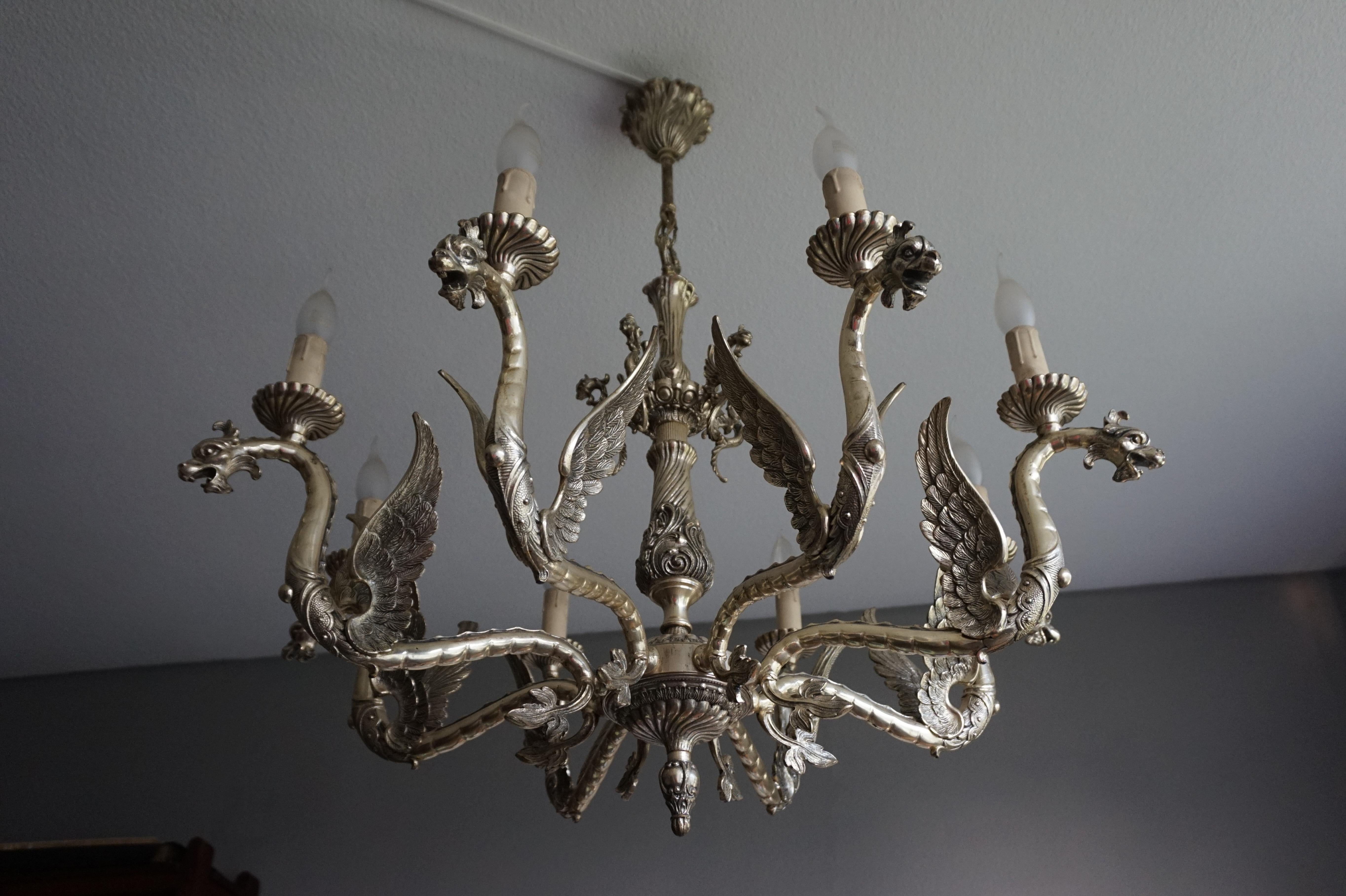 Large and remarkable, eight dragon arms chandelier.

This rare and remarkable eight light chandelier is marked 'DEPOSE' which means it was made in France. With all its ancient and less ancient châteaux, its many Gothic churches and with all the