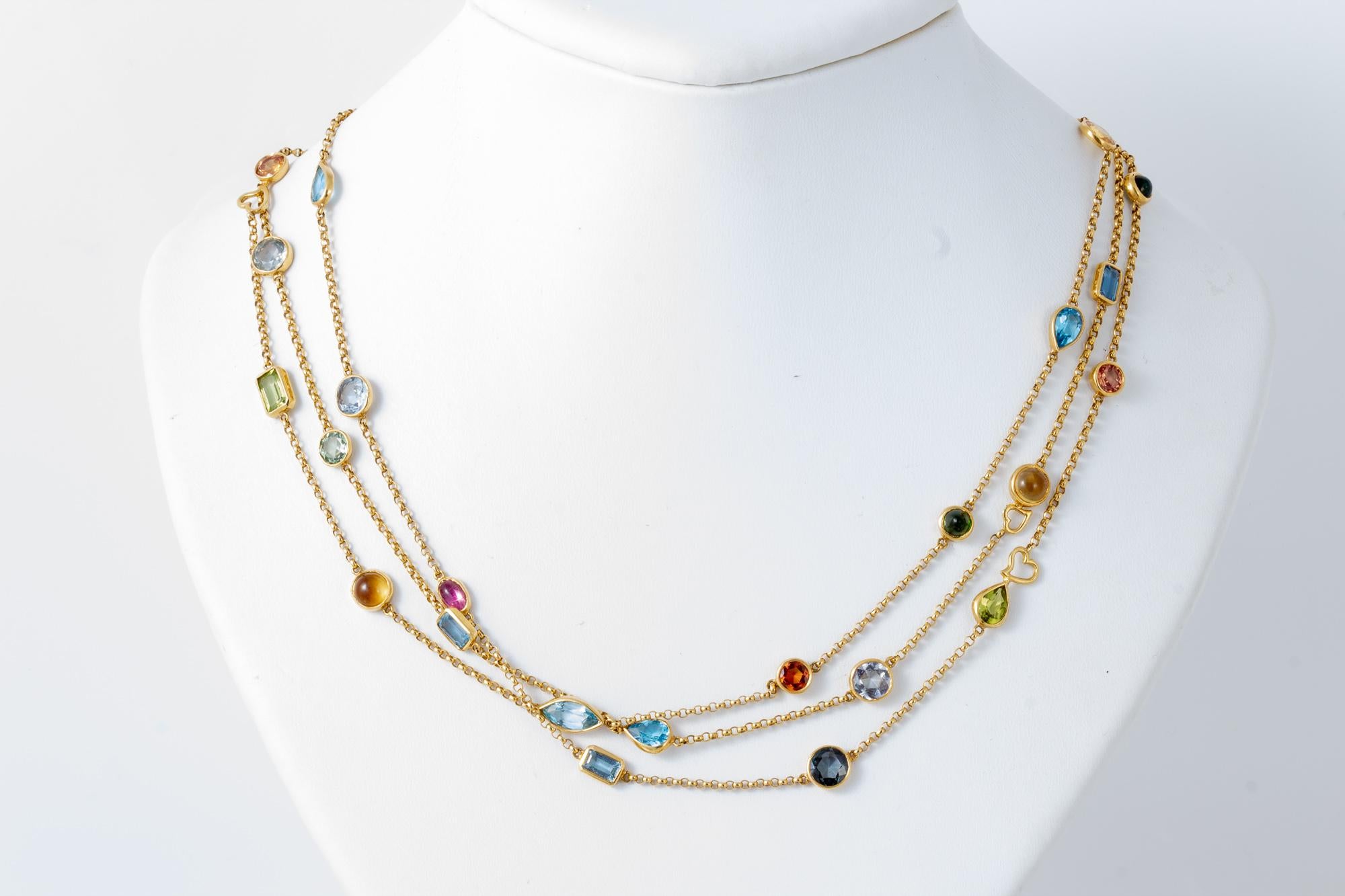 This extra long necklace (42 inches) can be worn as a single or double strand and features over 30 bezel set stones.  Featuring both cabochons and faceted stones, this versatile piece offers Tourmalines, Garnets, Aquamarine, Peridot and other