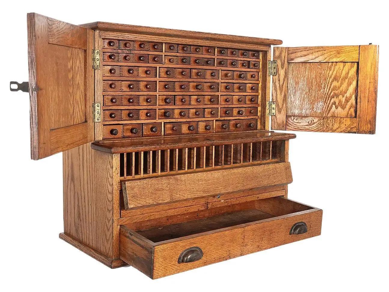 This is it best machinists tool chest we have ever found. It really shows the pride that both the cabinet maker and tool maker had. There are 75 individual finger jointed draws and a horizontal drop down door with graduated compartments. These