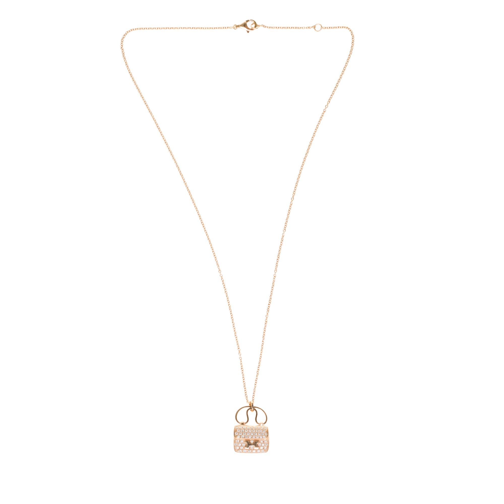 Splendid Hermès Amulette Constance pendant in rose gold set with 65 diamonds on adjustable chain in rose gold 750/1000

Signature: 
