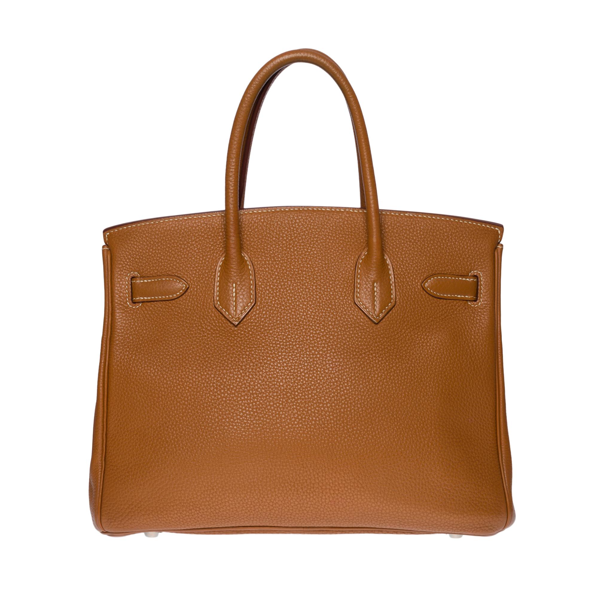 Stunning Hermes Birkin 30 handbag in Togo Camel leather (Gold), palladium silver metal hardware, double handle in camel leather allowing a hand carry

Flap closure
Camel leather lining, one zippered pocket, one patch pocket
Signature: 