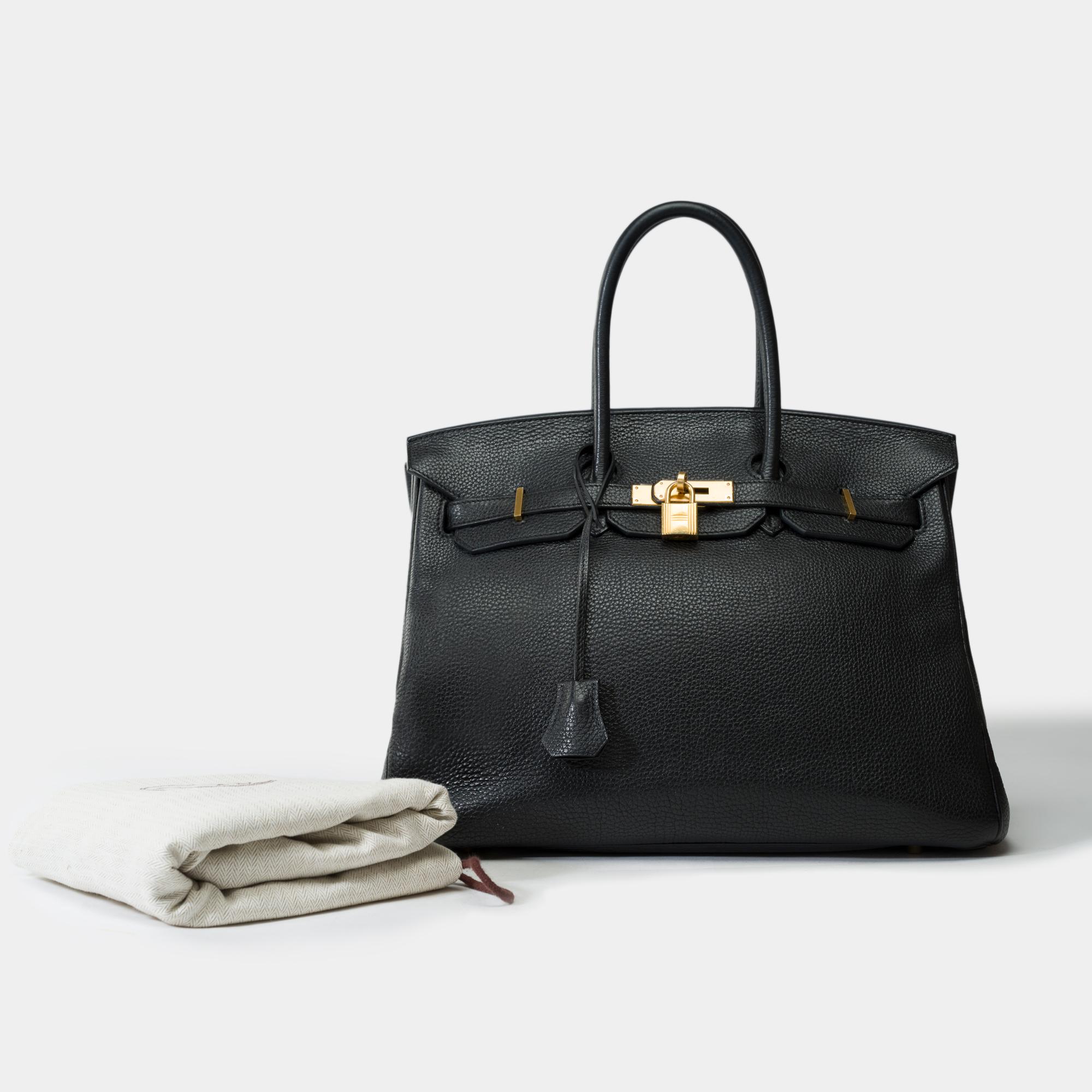 Very​ ​beautiful​ ​Birkin​ ​35​ ​handbag​ ​in​ ​Black​ ​Taurillon​ ​Clemence​ ​leather,​ ​gold​ ​metal​ ​trim,​ ​double​ ​handle​ ​black​ ​leather​ ​allowing​ ​a​ ​hand​ ​carry

Flap​ ​closure
Black​ ​leather​ ​lining​ ​,​ ​one​ ​zip​ ​pocket,​