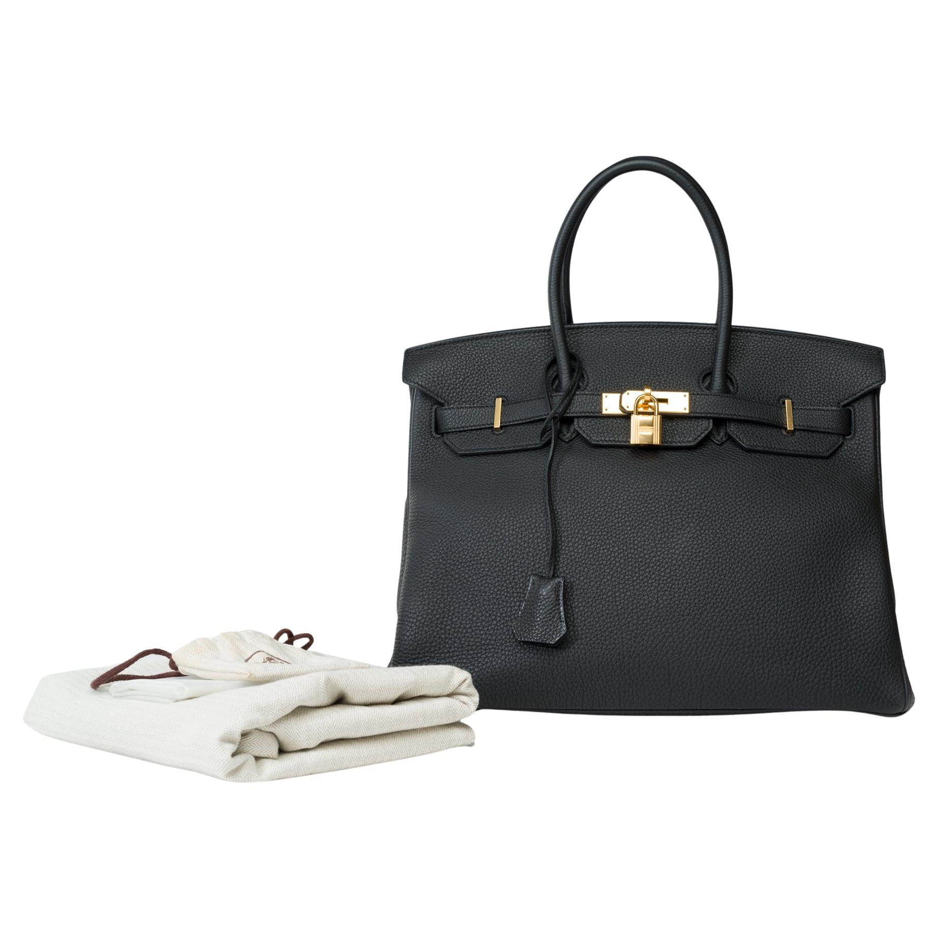 Stunning​​ ​​Birkin​​ ​​35​​ ​​handbag​​ ​​in​​ ​​black​​ ​​Togo​​ ​​leather​​ ​​with​​ ​​gold-plated​​ ​​hardware,​​ ​​double​​ ​​black​​ ​​leather​​ ​​handles​​ ​​for​​ ​​hand​​ ​​carry

Flap​​ ​​closure
Black​​ ​​leather​​ ​​interior​​ ​​with​​