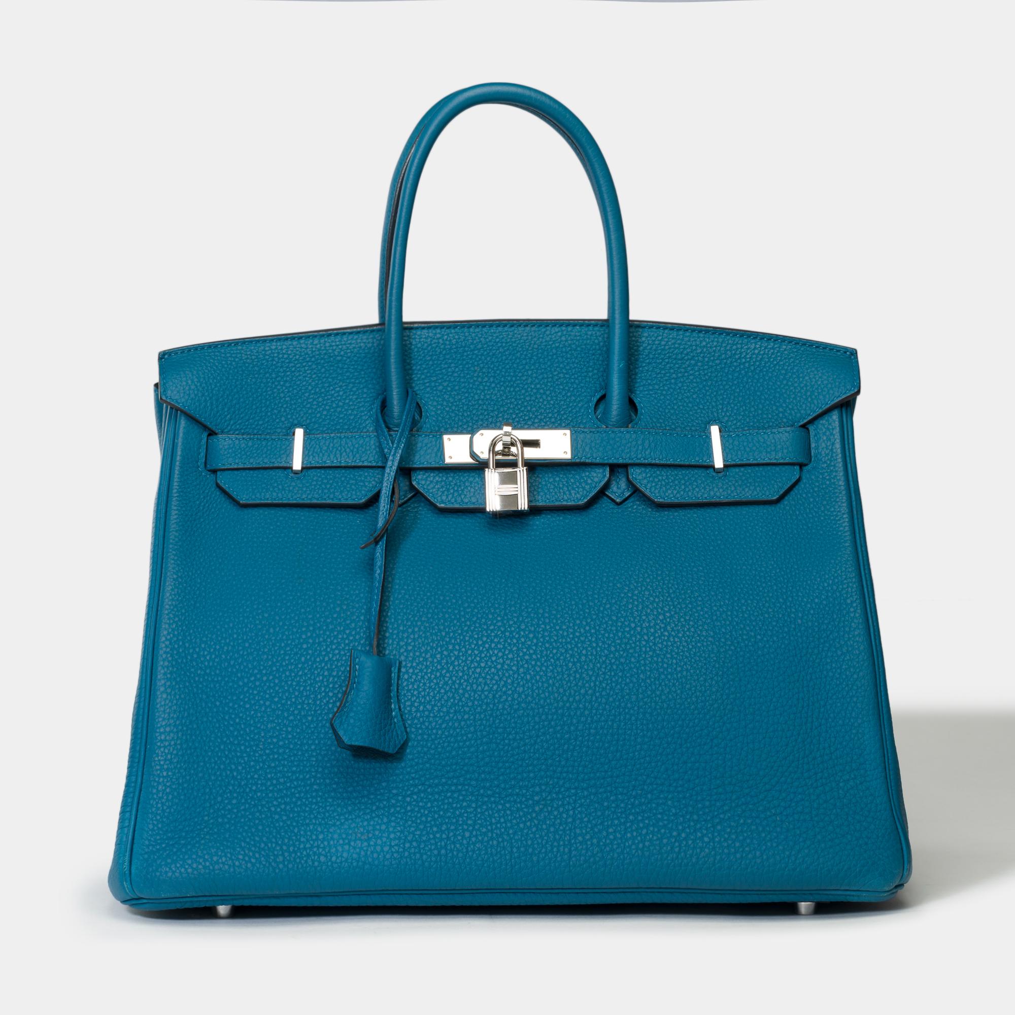 Amazing​ ​Hermès​ ​Birkin​ ​35​ ​in​ ​Blue​ ​Colvert​ ​Togo​ ​leather​ ​​ ​,​ ​palladium​ ​silver​ ​metal​ ​trim​ ​,​ ​double​ ​handle​ ​in​ ​blue​ ​leather​ ​for​ ​hand​ ​carry

Flap​ ​closure
Blue​ ​leather​ ​inner​ ​lining​ ​with​ ​beige​