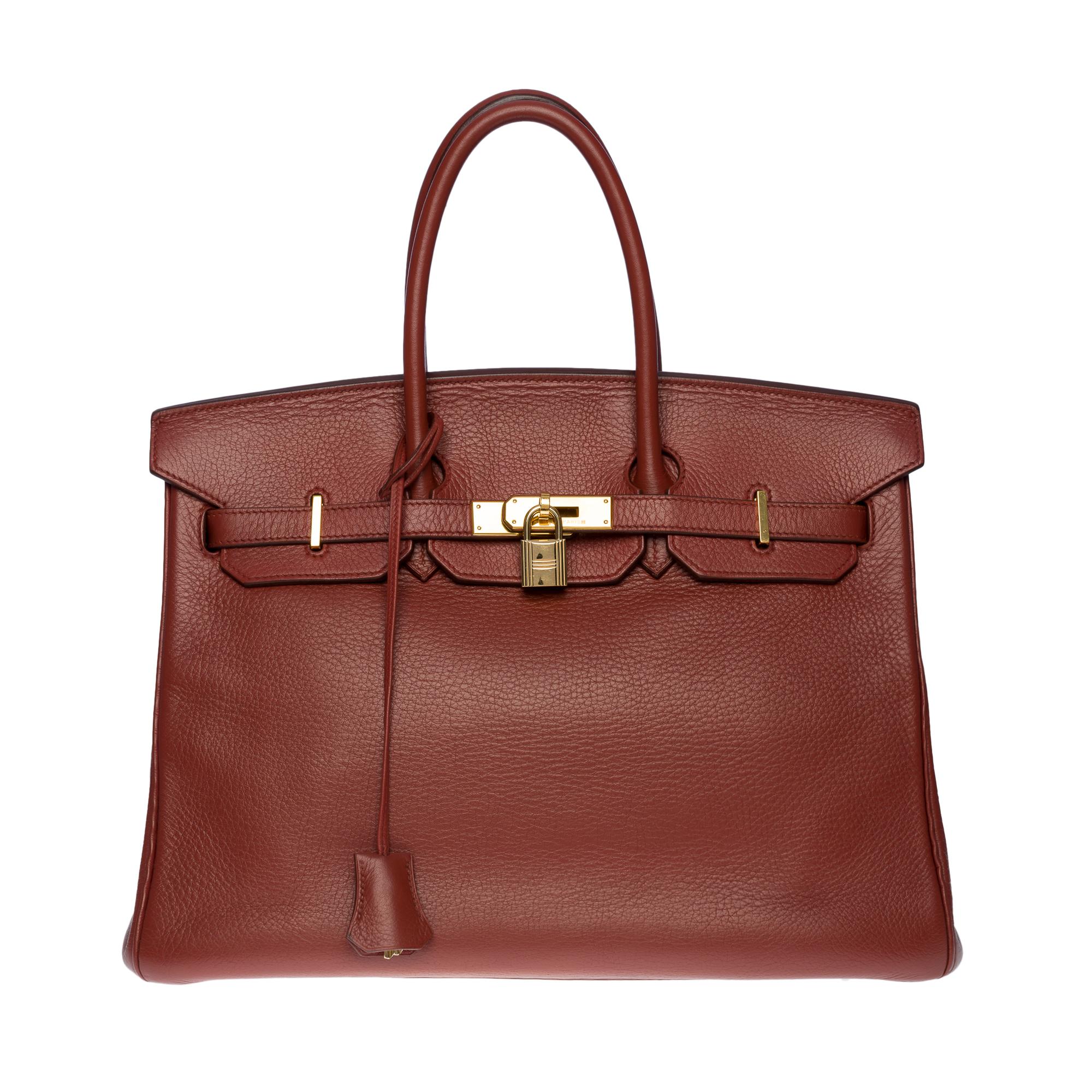 Exquisite Hermes Birkin 35 handbag in Togo Cognac leather, gold plated metal hardware, double cognac leather handle allowing a hand-held

Flap closure
Cognac leather lining, one zippered pocket, one patch pocket
Signature: 