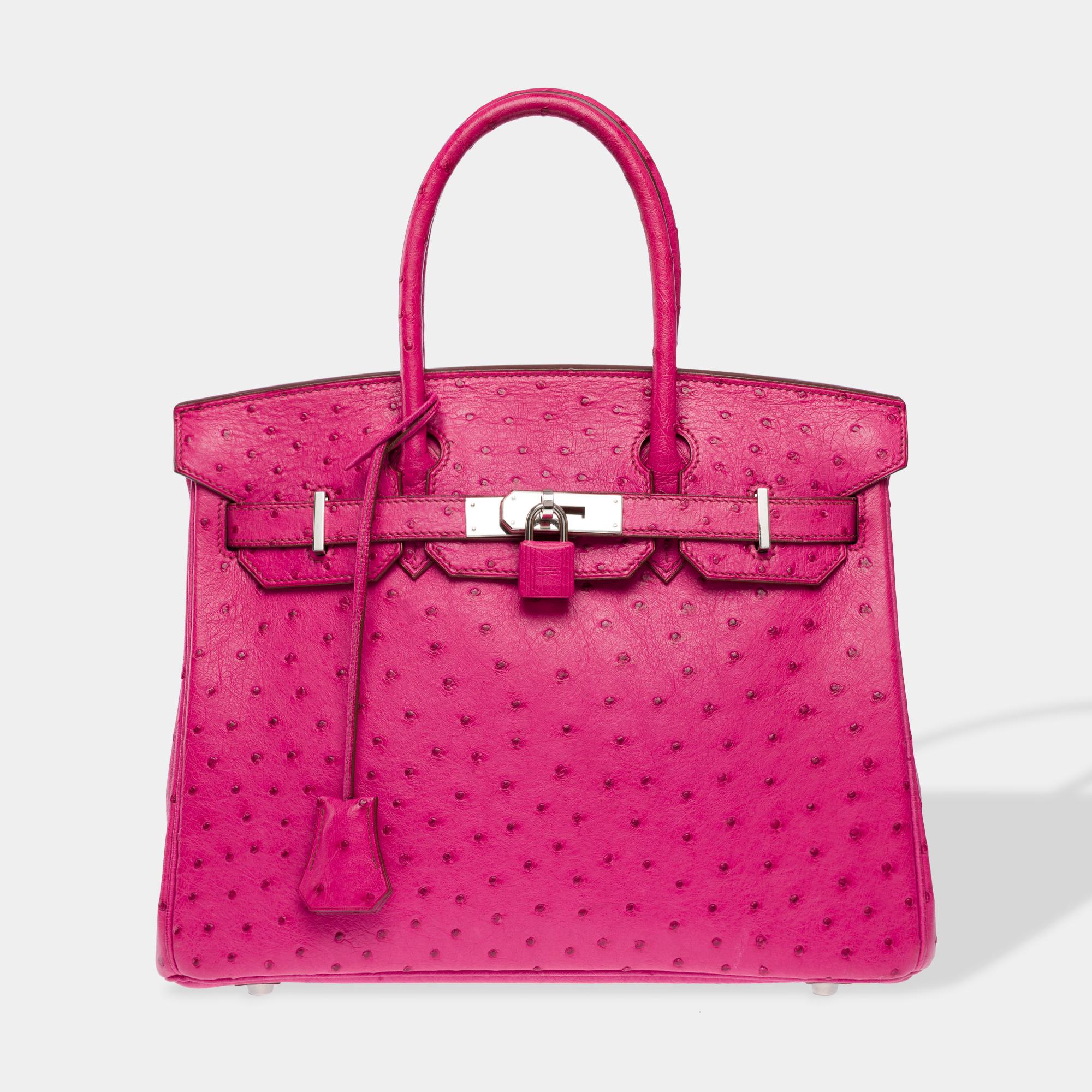 Exquisite​ ​and​ ​Luminous​ ​Hermes​ ​Birkin​ ​30 handbag​ ​in​ ​Fuchsia​ ​Pink​ ​Ostrich​ ​,​ ​silver​ ​palladium​ ​metal​ ​trim​ ​,​ ​double​ ​pink​ ​leather​ ​handle​ ​allowing​ ​a​ ​hand​ ​worn

Flap​ ​closure
Pink​ ​leather​ ​lining,​ ​one​