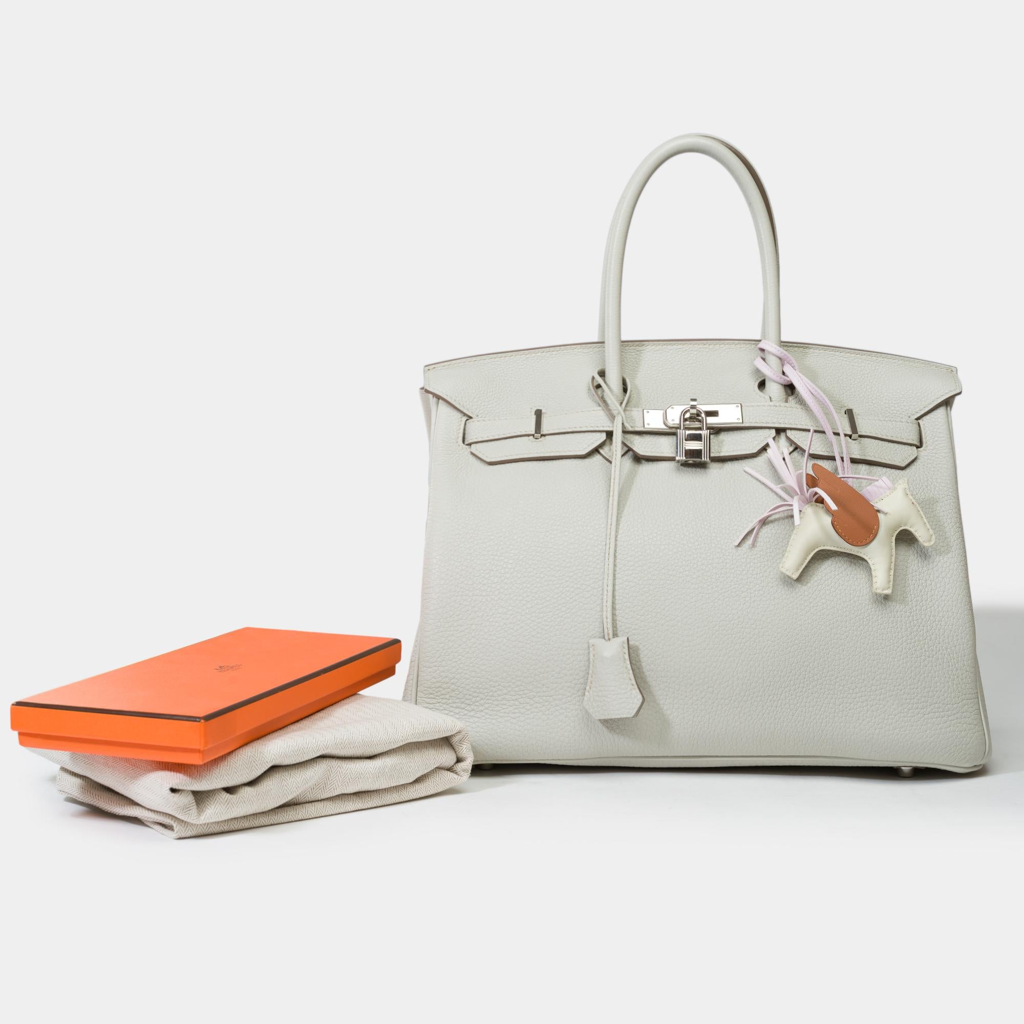 Exceptional​ ​Hermes​ ​Birkin​ ​35​ ​handbag​ ​in​ ​Gris​ ​Perle​ ​Togo​ ​leather​ ​,​ ​silver​ ​metal​ ​Palladium​ ​trim,​ ​double​ ​handle​ ​leather​ ​gray​ ​for​ ​a​ ​hand

Flap​ ​closure
Inner​ ​lining​ ​in​ ​grey​ ​leather​ ​,​ ​a​ ​zippered​