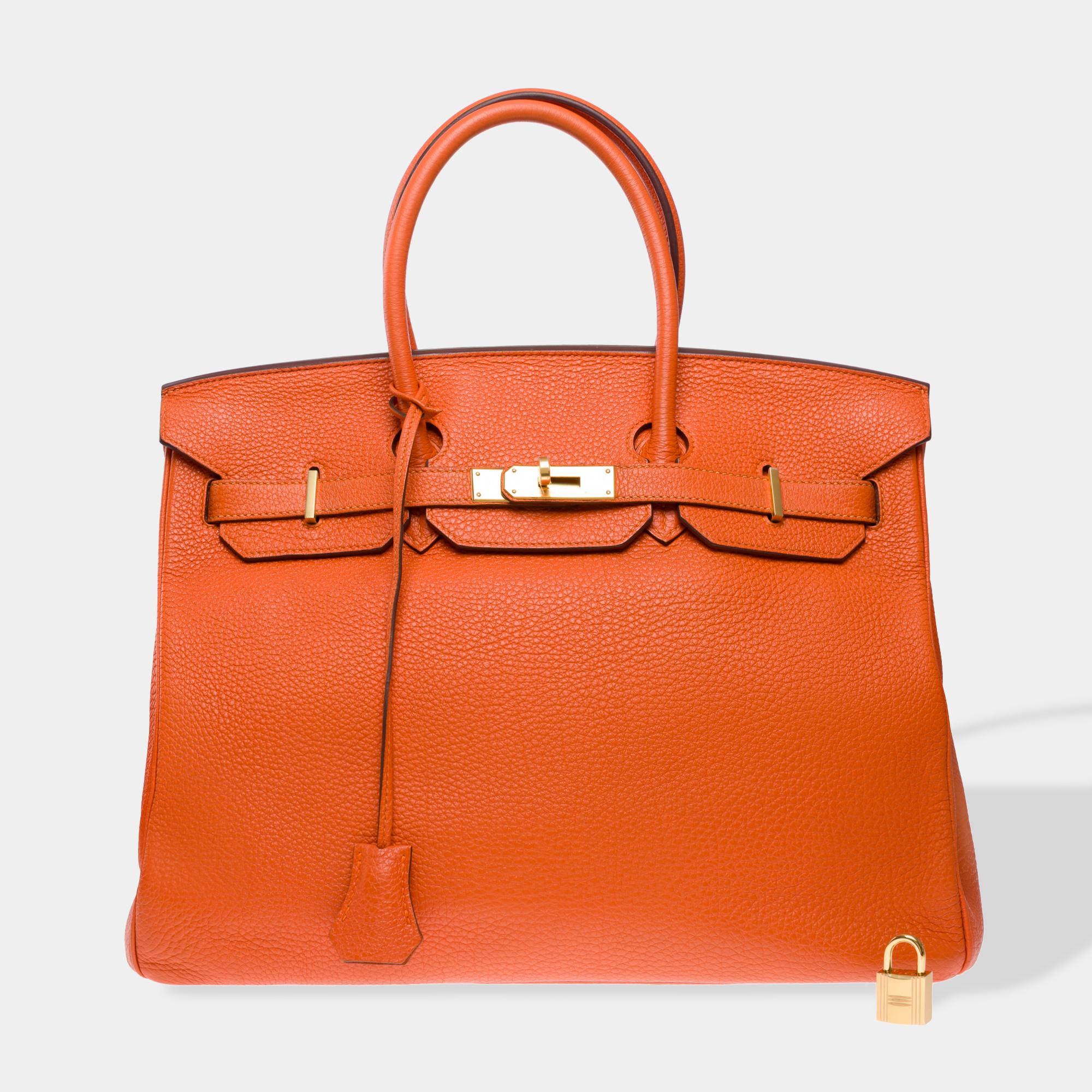 Beautiful​ ​and​ ​luminous​ ​Birkin​ ​35​ ​handbag​ ​in​ ​Orange​ ​H​ ​Togo​ ​calf​ ​leather​ ​,​ ​gold​ ​metal​ ​trim,​ ​double​ ​orange​ ​leather​ ​handle​ ​allowing​ ​it​ ​to​ ​be​ ​carried​ ​by​ ​hand

Flap​ ​closure
Interior​ ​lining​ ​in​