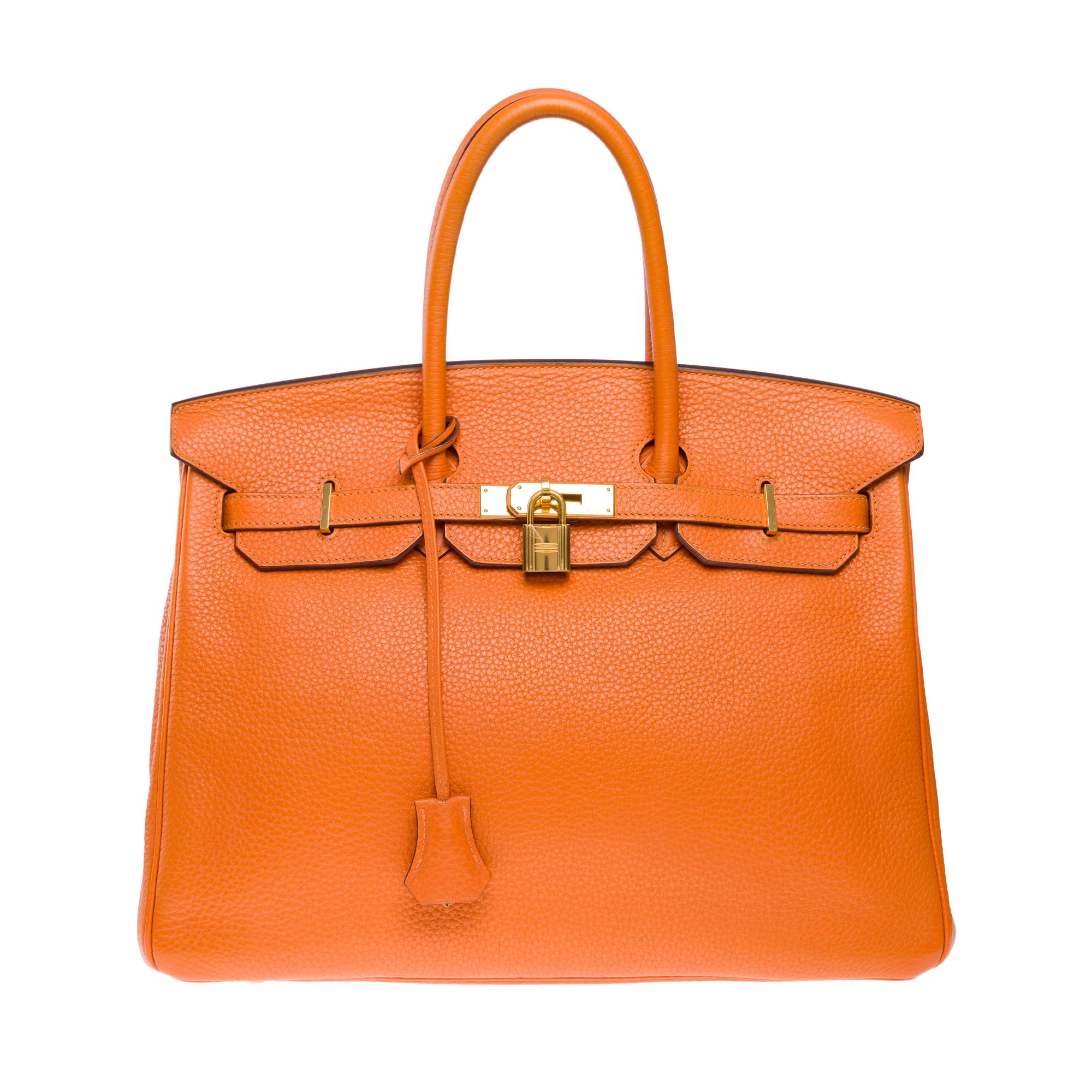 Bright​ ​Hermès​ ​Birkin​ ​35​ ​in​ ​Orange​ ​Togo​ ​calf​ ​leather,​ ​gold​ ​plated​ ​metal​ ​trim​ ​,​ ​double​ ​handle​ ​in​ ​orange​ ​leather​ ​allowing​ ​a​ ​hand​ ​carry

Flap​ ​closure
Inner​ ​lining​ ​in​ ​orange​ ​leather​ ​,​ ​a​