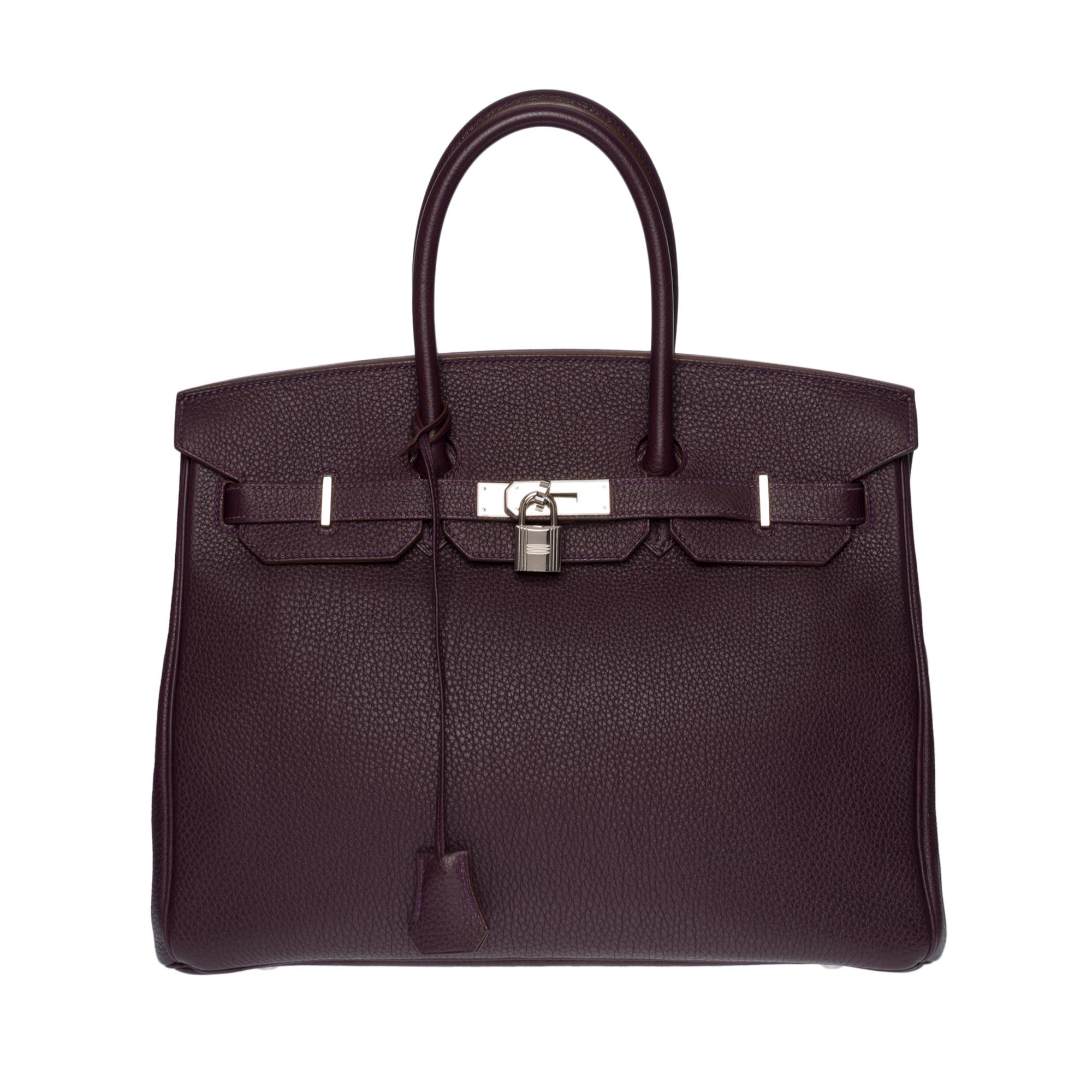Superb handbag Hermes Birkin 35 cm in Togo Raisin leather, palladium silver metal hardware, double handle in purple leather for a hand-carried

Flap closure
Inner lining in purple leather, one zippered pocket, one patch pocket
Signature: 