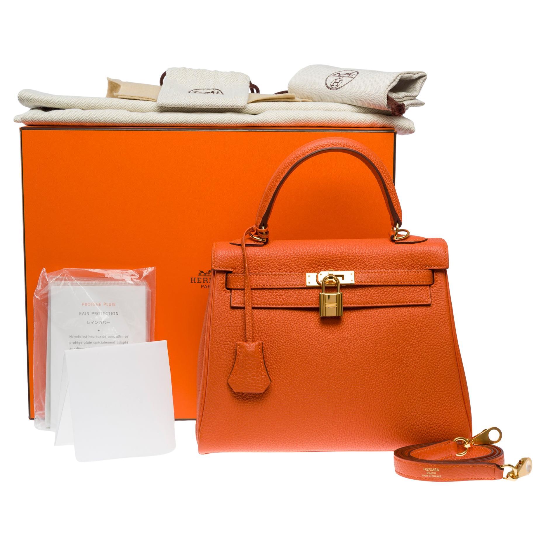 Amazing Hermès Kelly 25 retourne handbag strap in Orange Feu Togo leather , GHW For Sale