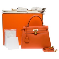 Amazing Hermès Kelly 25 retourne handbag strap in Orange Feu Togo leather , GHW