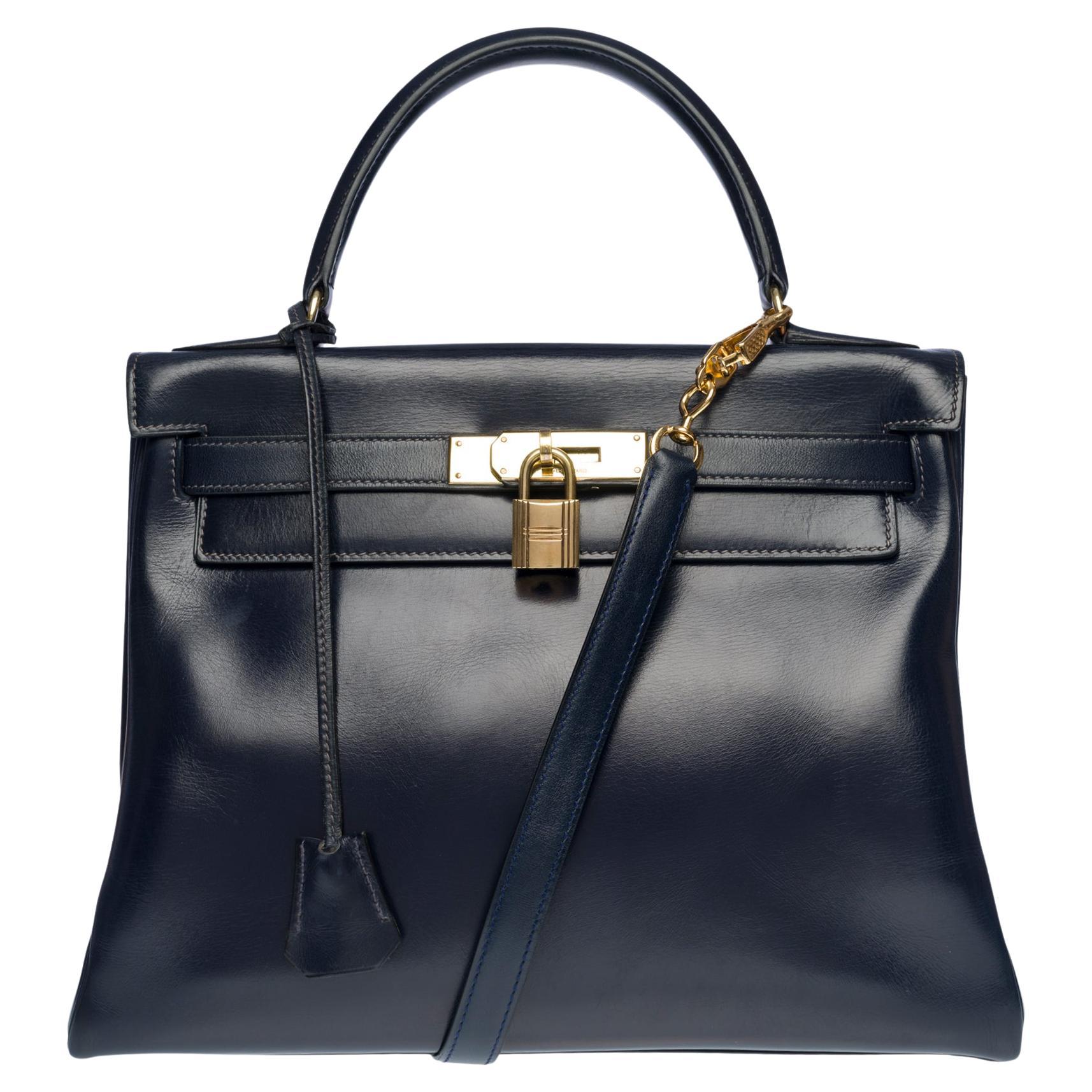 Amazing Hermes Kelly 28 retourne handbag strap in Navy blue box calfskin, GHW