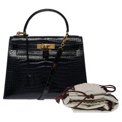 Amazing Hermes Kelly 28 sellier handbag strap in black Crocodile Porosus, GHW