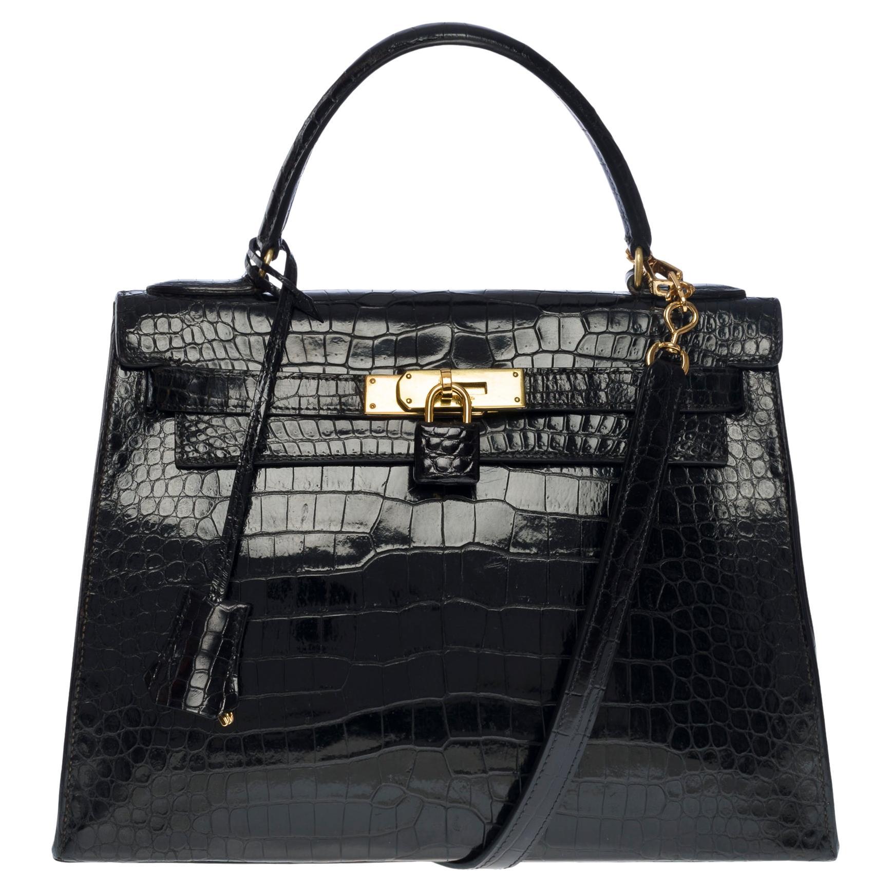 Amazing Hermes Kelly 28 sellier handbag strap in black Crocodile Porosus, GHW
