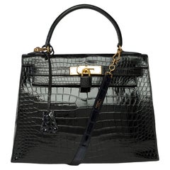 Amazing Hermes Kelly 28 sellier handbag strap in black Crocodile Porosus, GHW