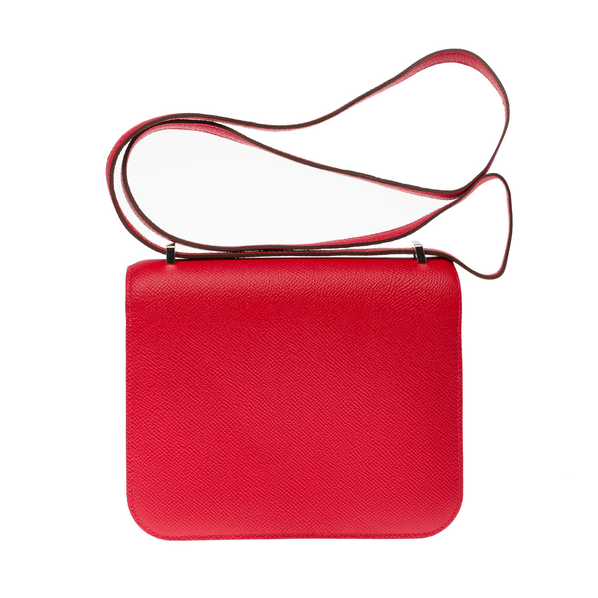 Splendid shoulder bag Hermes Constance III mini 18cm in rouge casaque epsom leather, embossed in silver palladium plated metal, a shoulder strap handle transformable into red epsom leather allowing a shoulder or shoulder strap.

Logo closure on