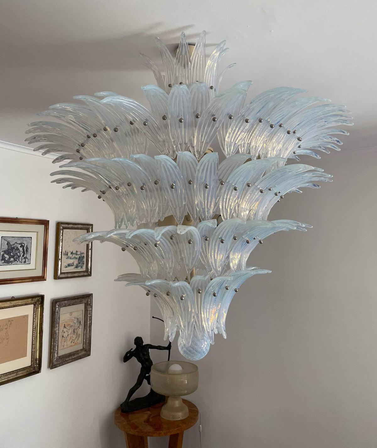 Palmette ceiling light made by 152 Murano opaline glasses in a gold metal frame. Murano blown glass in a traditional way. Structure in gold colored metal.
Period: 1980s.

 