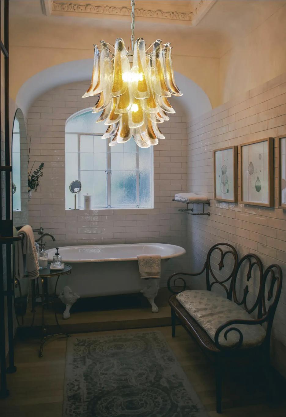 Huge Italian vintage Murano chandelier made by 41 glass petals (transparent and amber) in a gold painted metal frame. Period: late 20th century
Dimensions: 46 inches (117 cm) height with chain; 25,60 inches (65 cm) height without chain; 22,85 inches