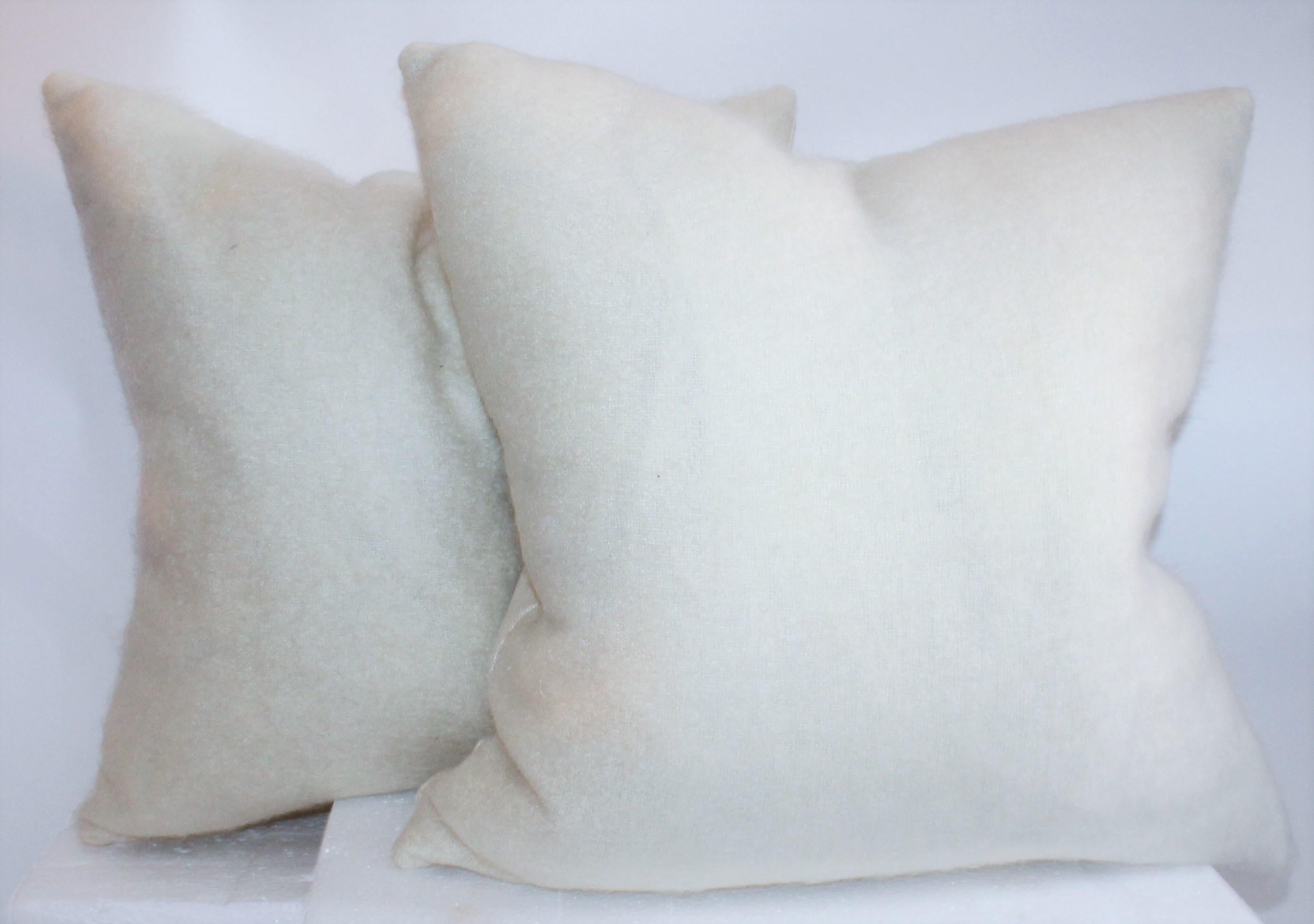 These amazing handmade lambs wool pillows are in Fine condition with cotton linen backings. The inserts are down and feather fill. 

1 pair of 22 x 22 / 1 pair of 20 x 20 ( Total two pairs).