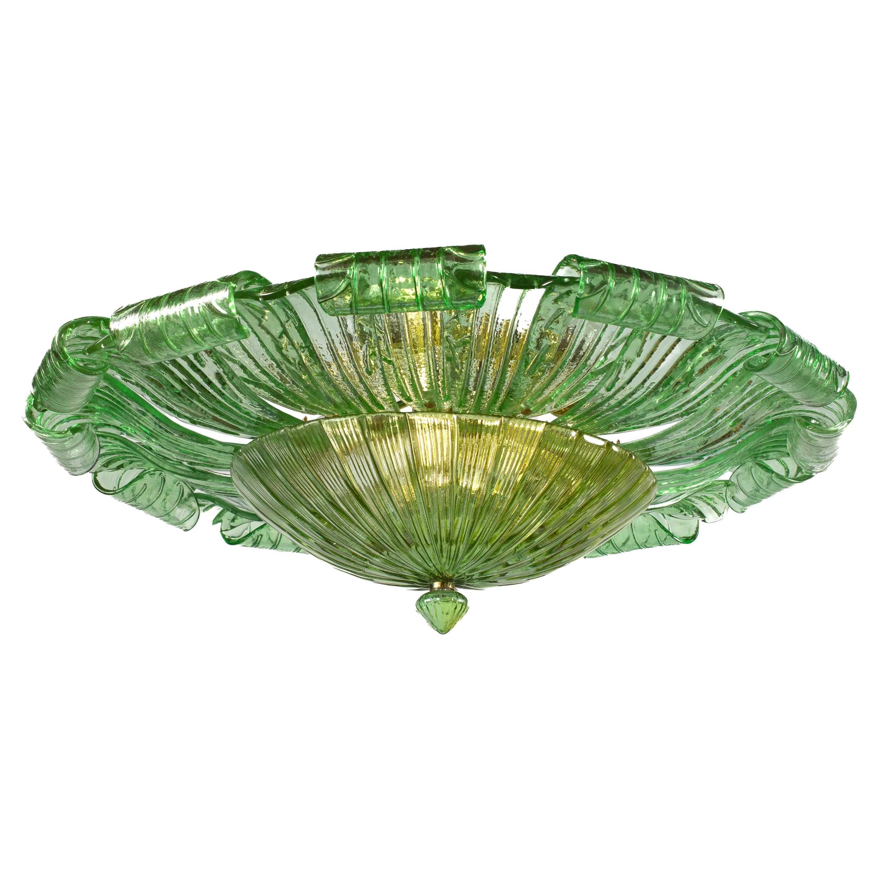 Realized in pure Emerald green color Murano glass consists of 24 large hand-blown leaves.
 The structure is gilt-metal. Nine E27  lights bulbs  spread a magical light.
 Wattage 4-6 W 
 Weight ; 28 kg

Available also a pair.
This light fixture can be