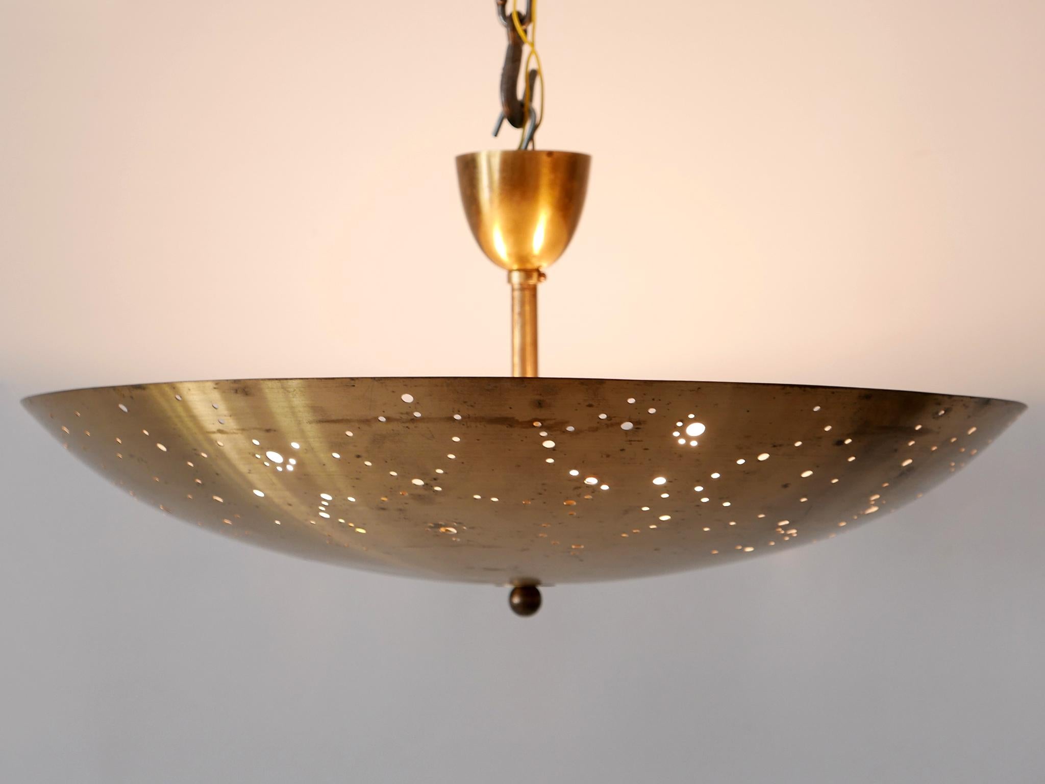 Extremely rare, elegant and highly decorative Mid-Century Modern perforated brass ceiling fixture / pendant lamp 