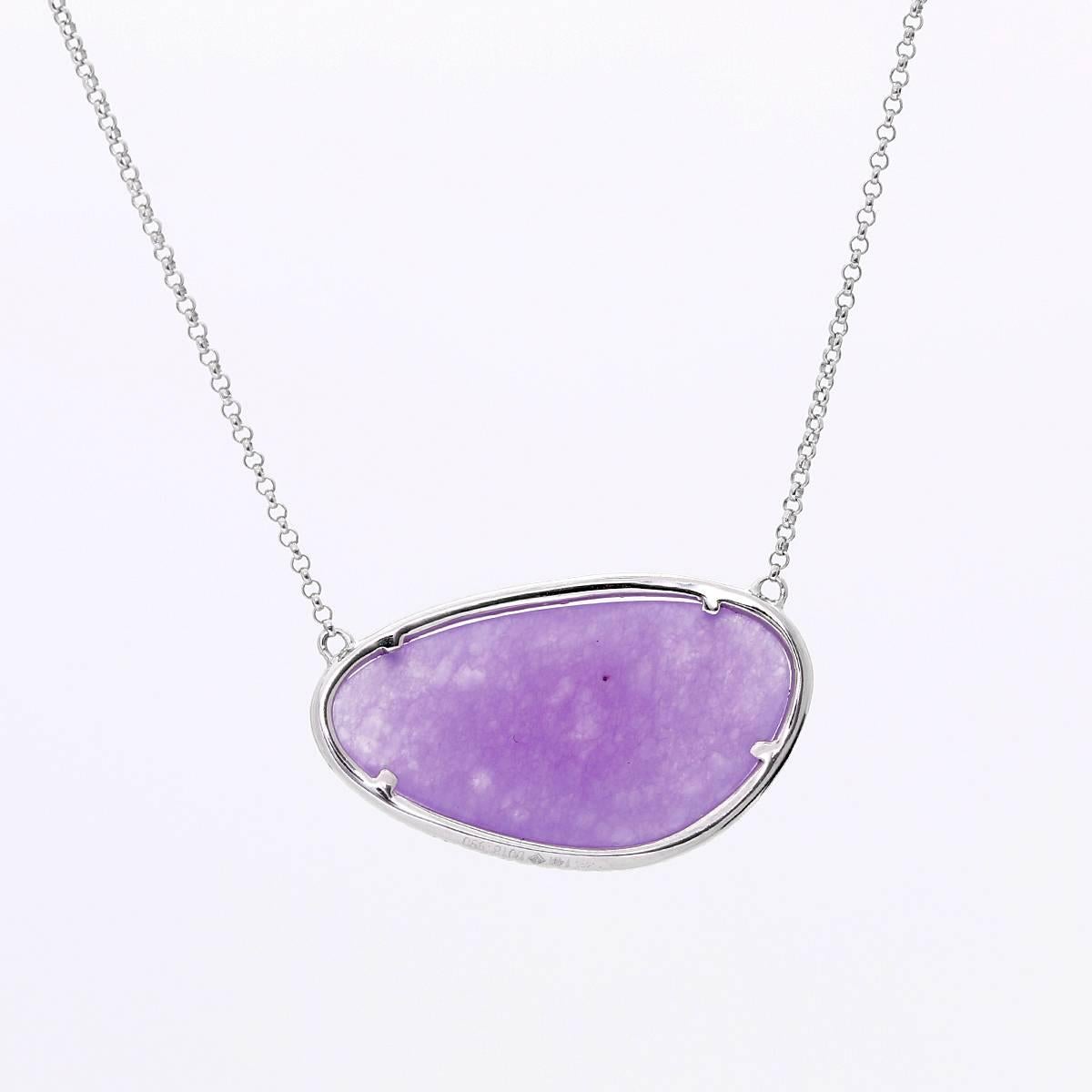 This amazing necklace features a 19.90 carat lavender jade bordered by 0.18 carats of diamonds set in 14k white gold.  The pendant measures apx. 1-inch  in width at the widest and apx. 5/8-inch in length at the longest.  The necklace measures apx.