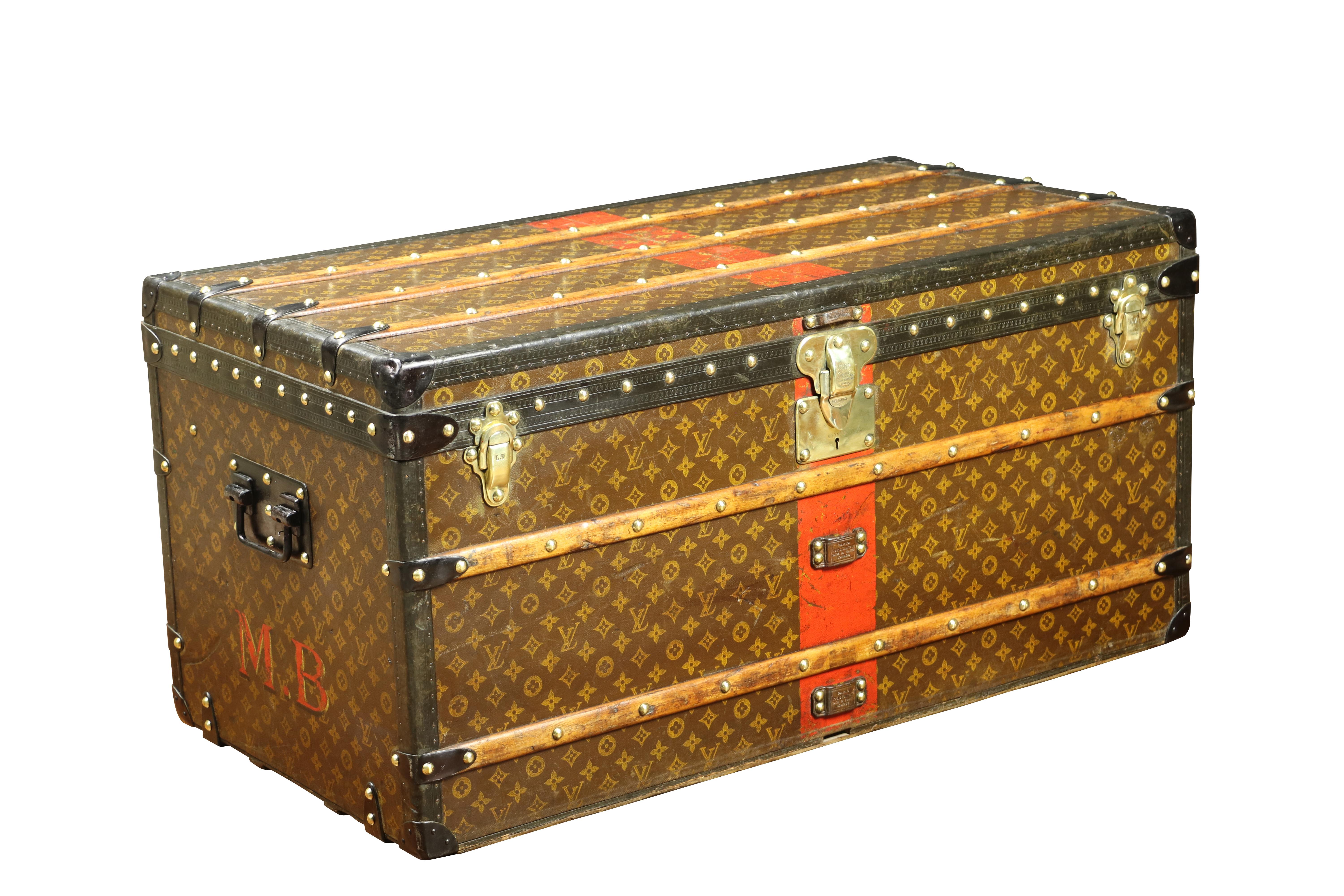 LOUIS VUITTON, Circa 1914
Splendid Louis Vuitton Monogram Courrier/Mail Trunk with Stencil, Solid Brass Hardware, Central Lock Numbered 033094, 3 Wood Front Reinforcements, Metal Handles
Monogram nails
Monogram 