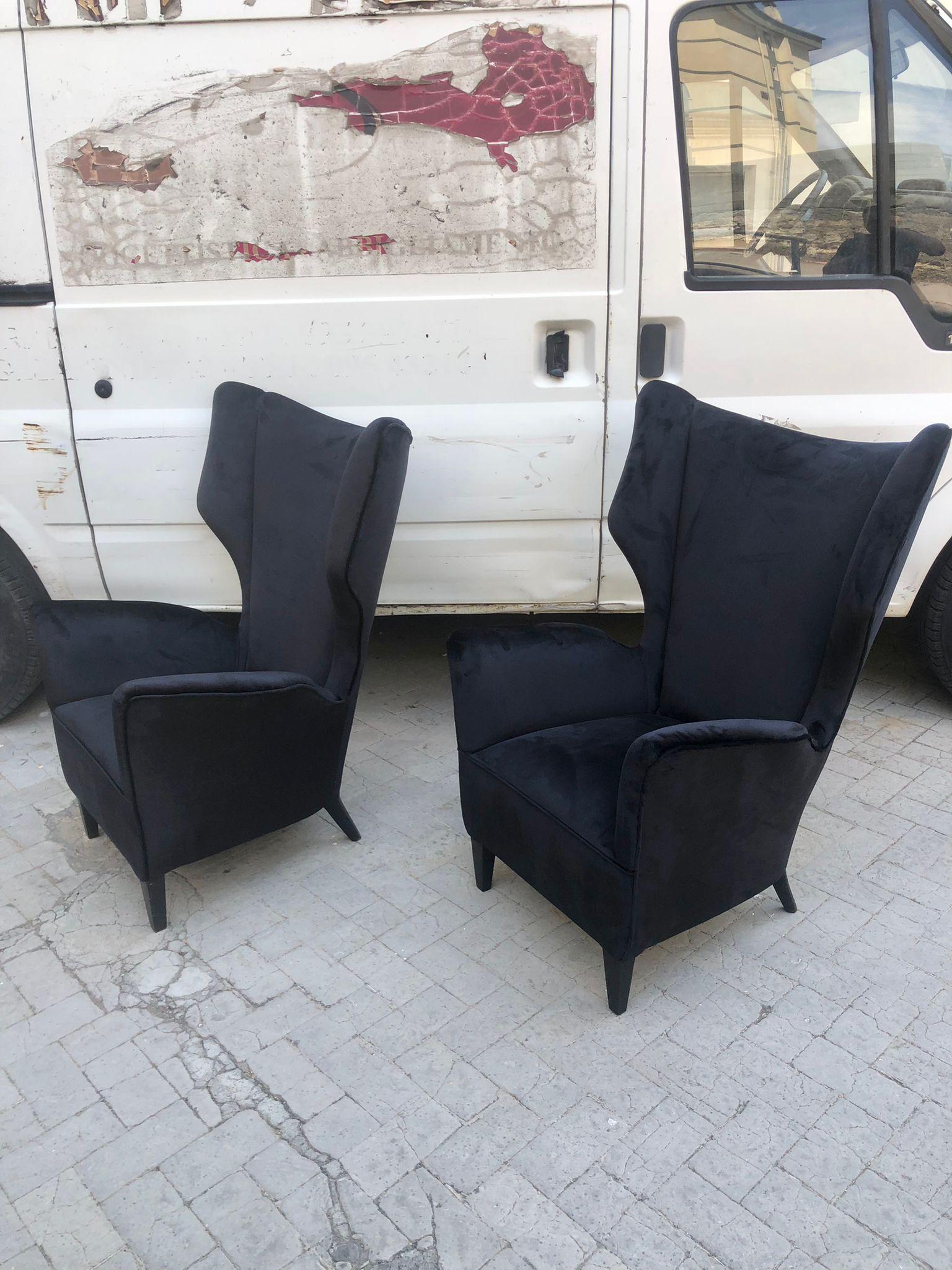 Set of two armchairs produced for an important 1950s hotel design Gio Ponti attr. The armchairs are characterized by a beautiful backrest and an elegant and typical line of Gio' Ponti's style. They have been reupholstered with a high quality