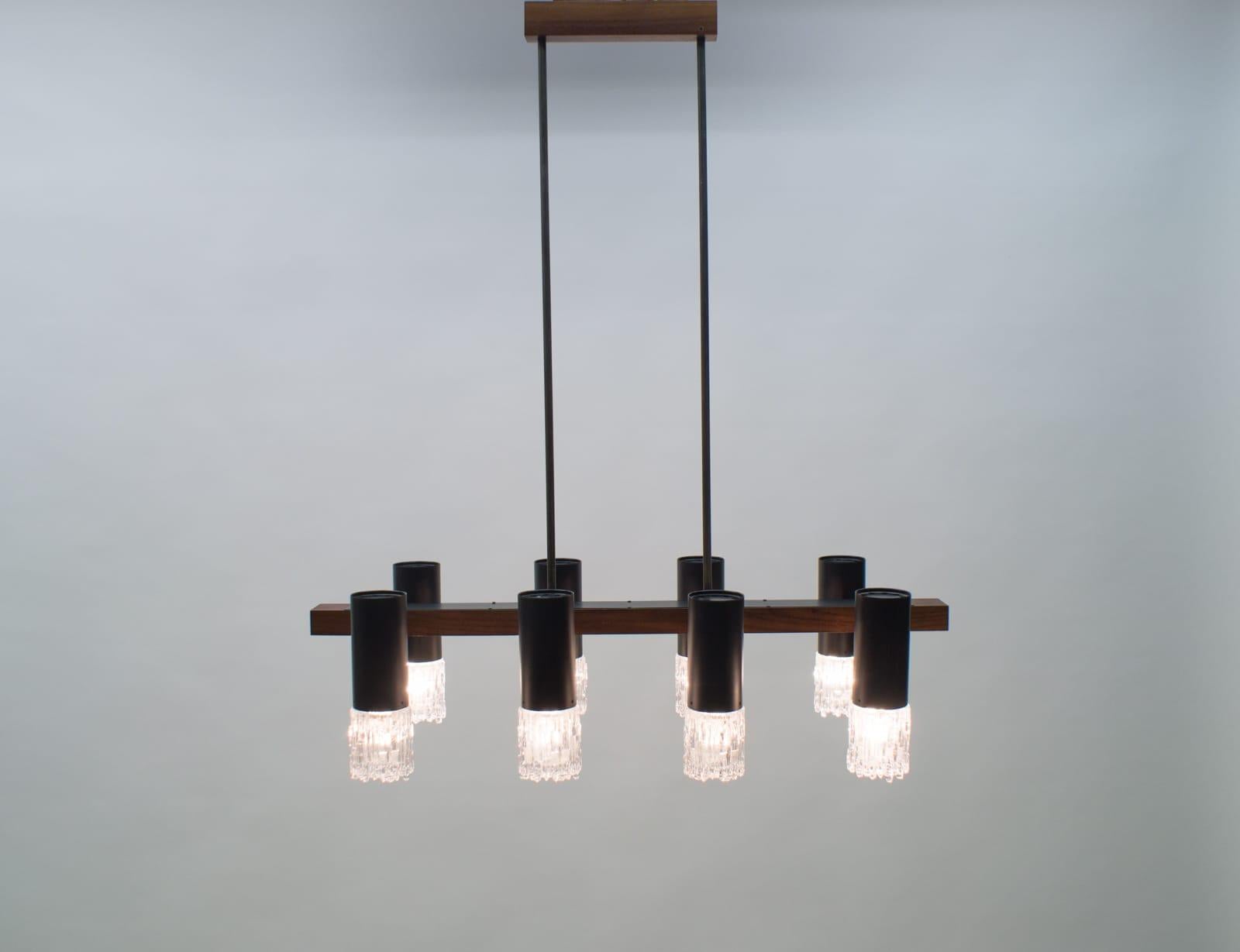 Amazing Mid-Century Modern pendant lamp or hanging light, 1960s.

It comes with 8 x E14 Edison screw fit bulb holders, is wired, and in working condition. It runs both on 110/230 volt.
 