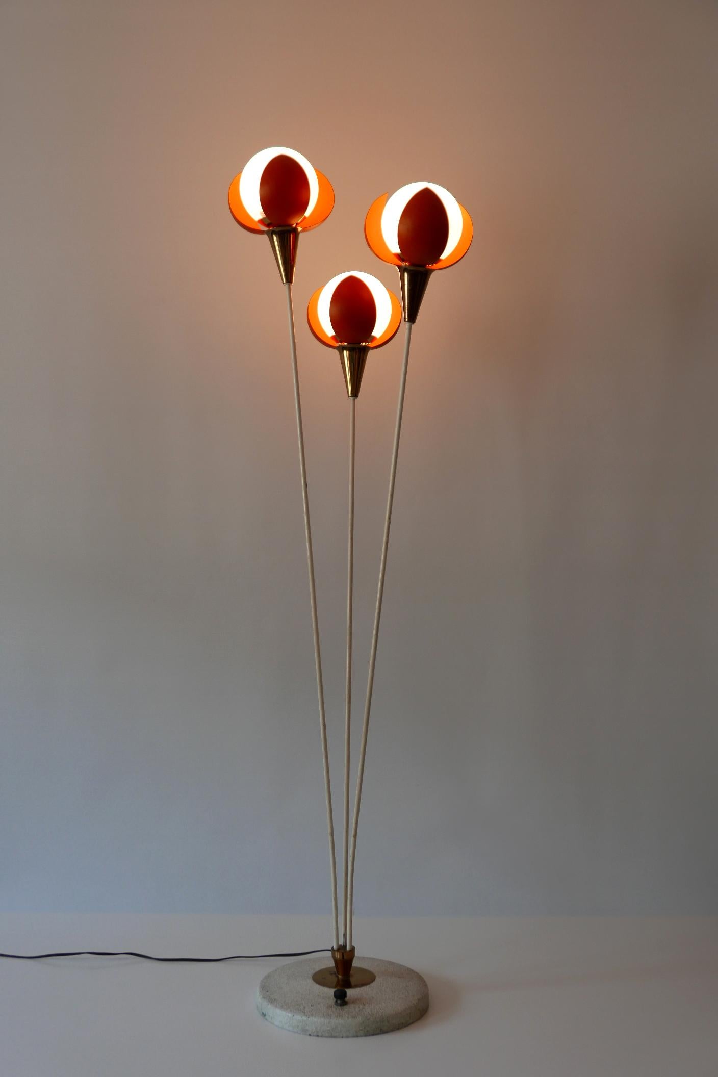 Lovely and extremely rare 3-flamed Mid-Century Modern floor lamp 'Buds'. Designed and manufactured probably in France, 1950s.

Executed in orange color enameled metal sheet, white metal tubes, brass sheet, cast iron and opaline glass, the lamp