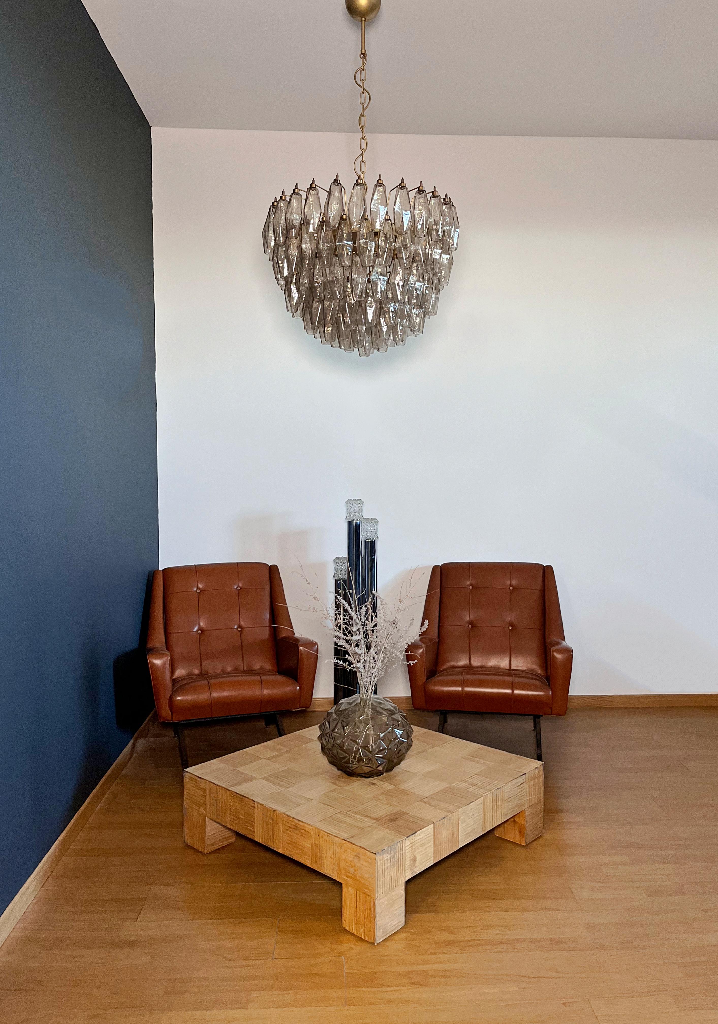 It sounds like you have a stunning piece of art with that Italian pendant light! The combination of 111 smoked Murano glasses and a gold and brass structure creates a truly elegant aesthetic. Here's a quick summary of its features:
Weight of
