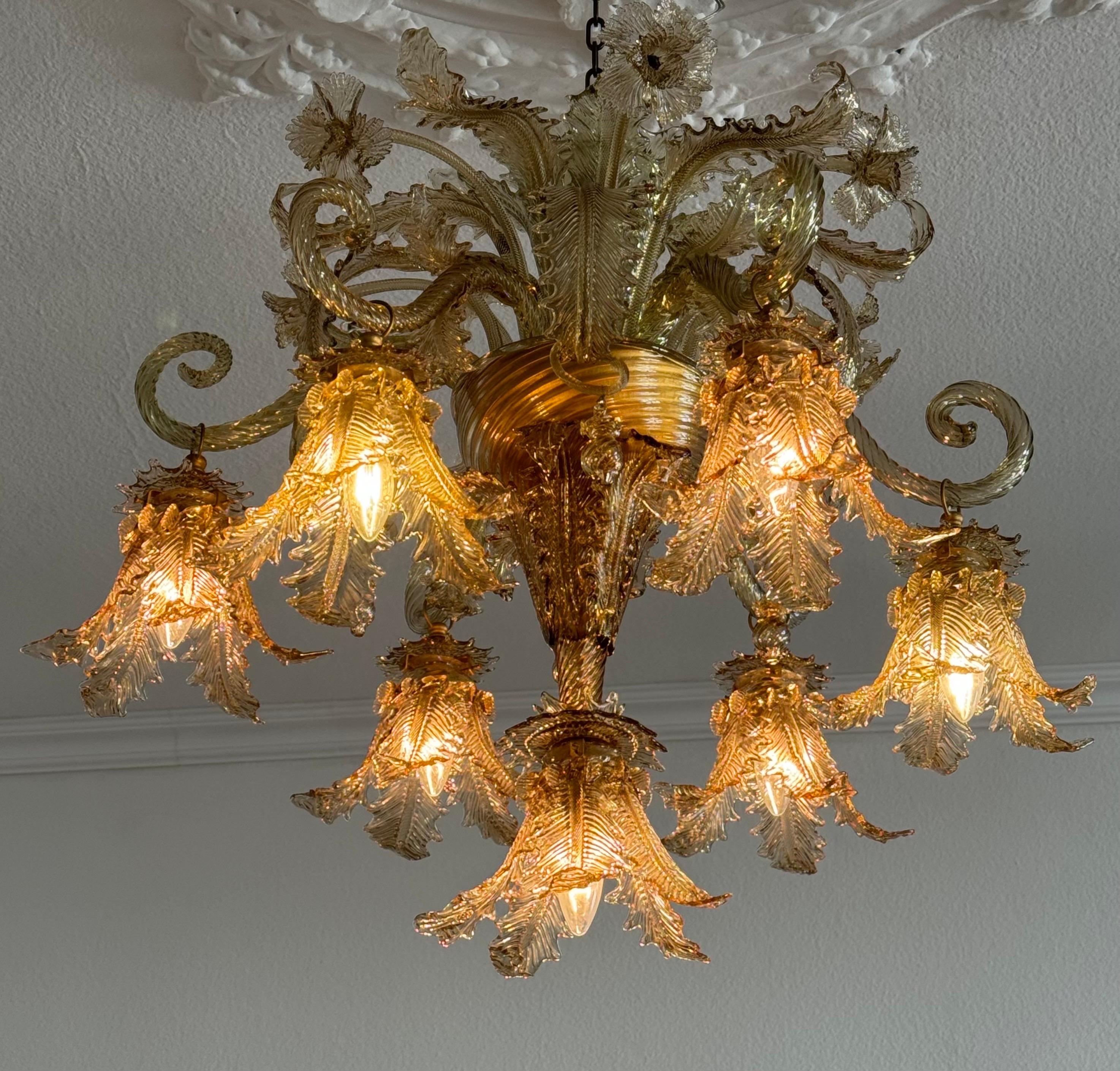 An exceptional and rare seven- lights Murano glass chandelier by Barovier e Toso, Italy, ca. 1940s.
This beautiful chandelier is richly decorated with flowers and leaves in cognac color.
Socket: 7 x e27 for standard screw bulbs.
New wiring for US