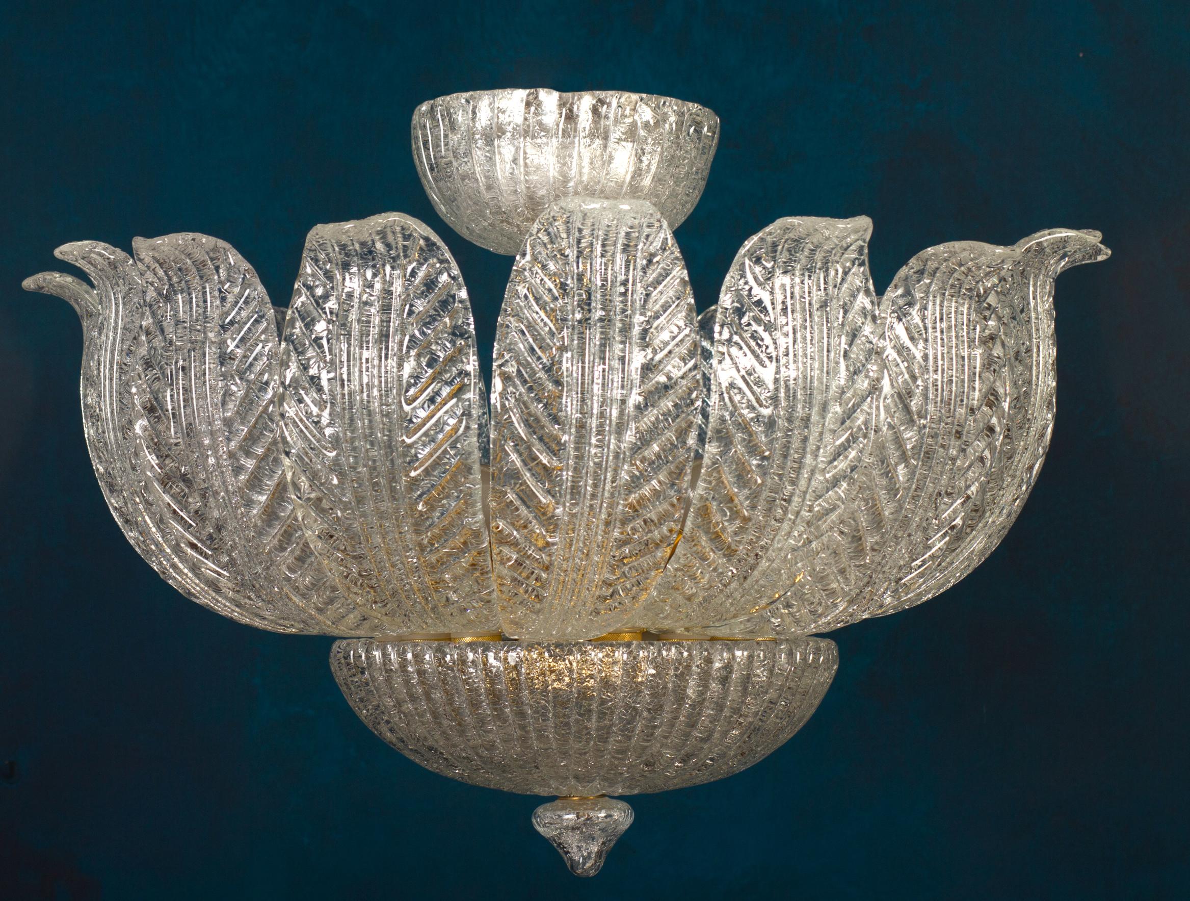 Fine murano glass chandelier, made of precious hand blown ice leaves glasses, has the look of a precious big flower.
Cleaned and re-wired, in full working order and ready to use. In excellent vintage condition. The leaves, all original and in good