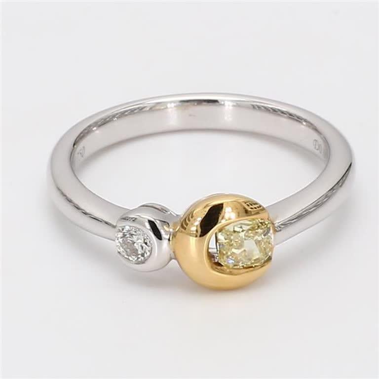 RareGemWorld's classic diamond band. Mounted in a beautiful 18K Yellow and White Gold setting with a natural radiant cut yellow diamond complimented by a natural round cut white diamond. This band is guaranteed to impress and enhance your personal