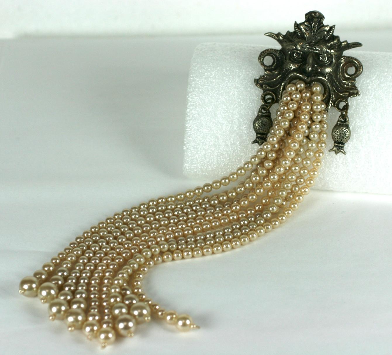 Massive Neptune fountain head brooch of antique silver plated base metal. With the head of Neptune spitting multiple strands of  graduated faux pearls. Accented with articulated long lantern like earrings.
Excellent Condition, Signed Italy. 
Length