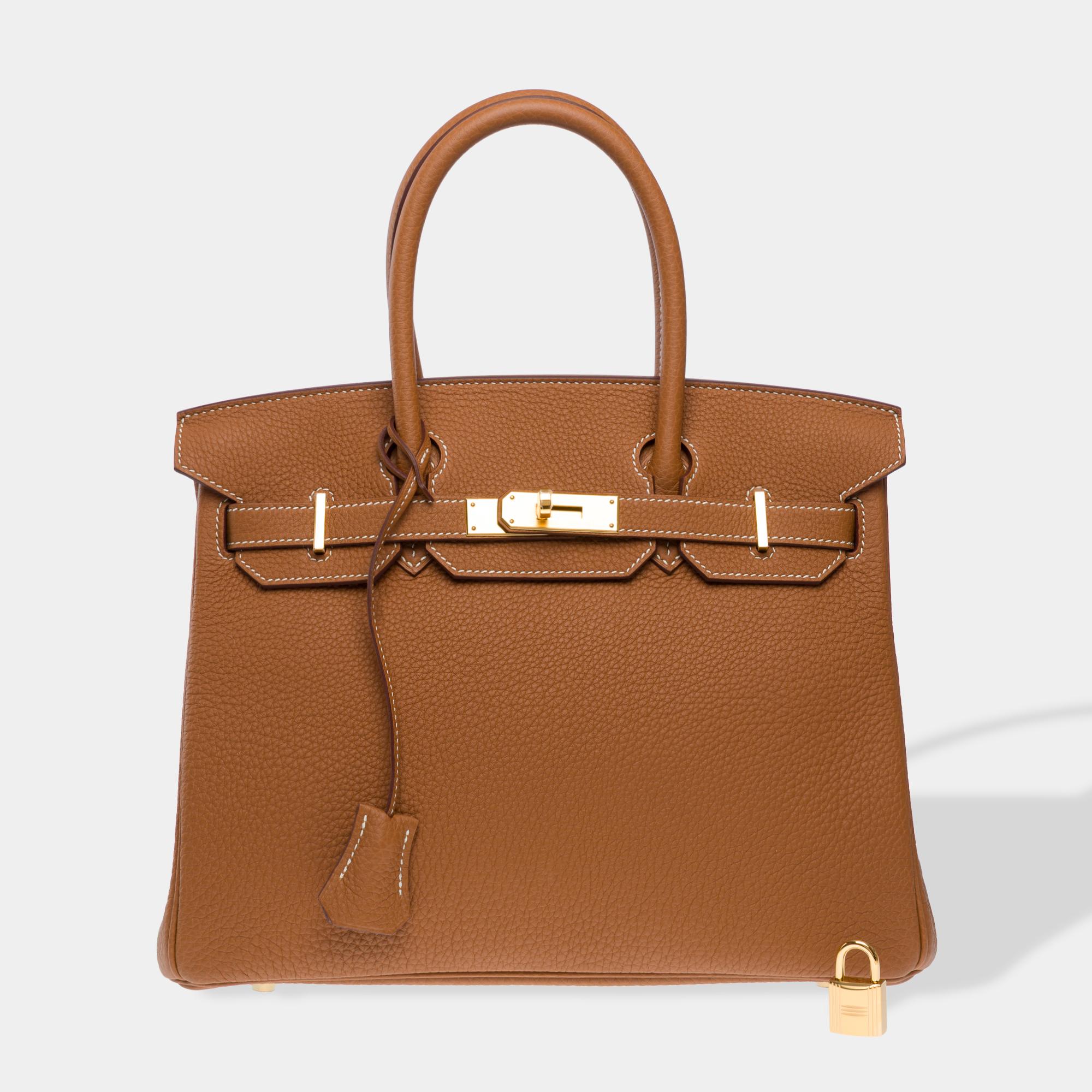 Amazing​ ​Hermes​ ​Birkin​ ​30​ ​handbag​ ​in​ ​Gold​ ​(Fauve)​ ​Togo​ ​calfskin​ ​leather,​ ​gold​ ​metal​ ​trim,​ ​double​ ​gold​ ​leather​ ​handle​ ​for​ ​carrying​ ​by​ ​hand

Flap​ ​closure
Gold​ ​leather​ ​lining,​ ​one​ ​zipped​ ​pocket,​