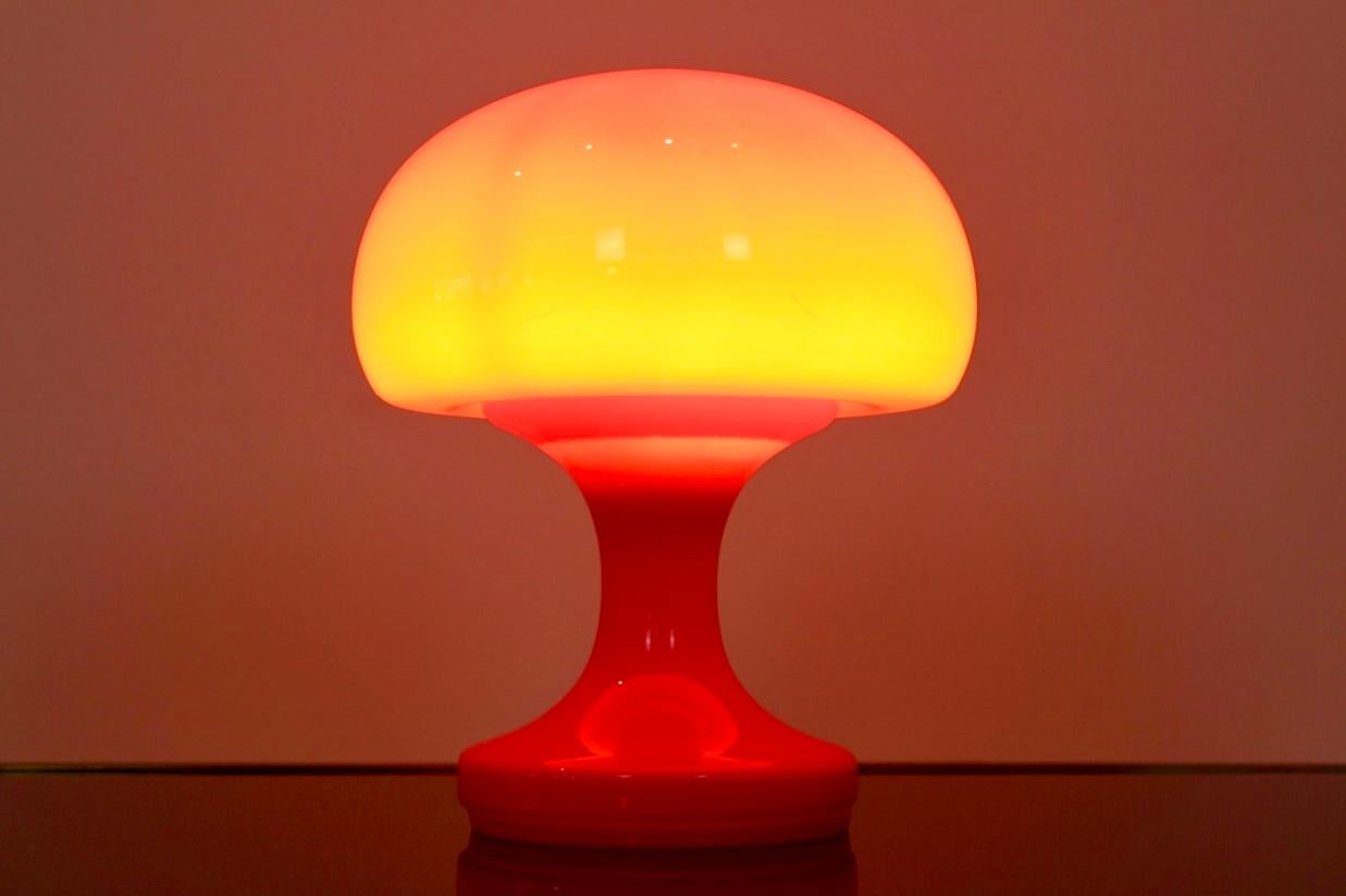 Beautiful orange opaline glass mushroom table lamp, produced by OPP Jihlava in the former Czechoslovakia in the 1960s. Designed by Štepán Tabery. The lamp features an orange base and a mushroom round glass top. In excellent condition. With beautiful