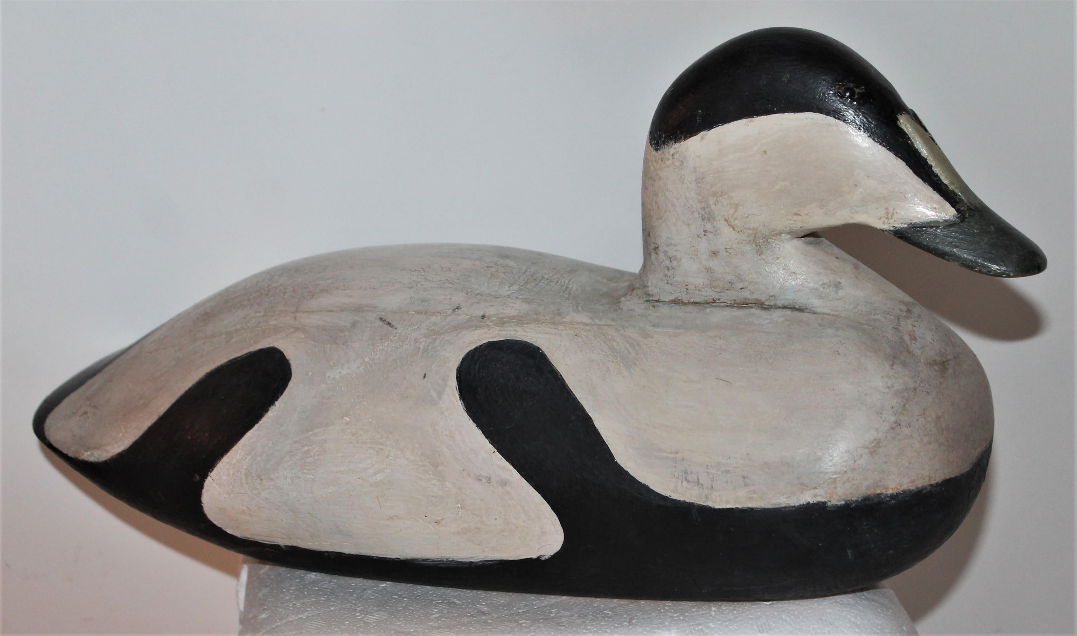 Amazing original painted decoy in black & white painted surface. It is signed 