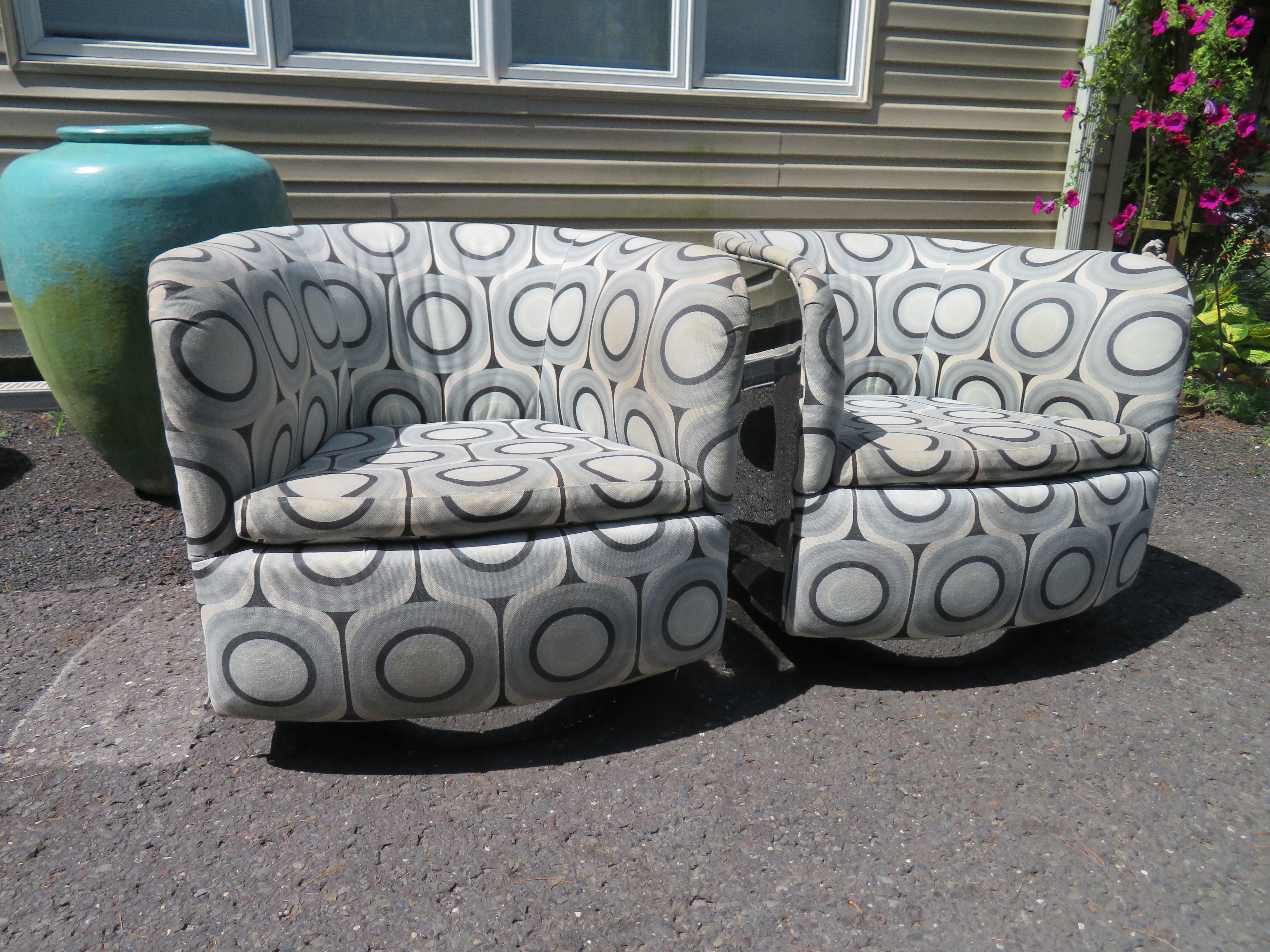 Amazing pair of chrome-clad Milo Baughman barrel back swivel rocker chairs. These are the Holy grail of Milo Baughman's designs and are in nice vintage condition. The upholstery is original and will need to be re-upholstered. These are super