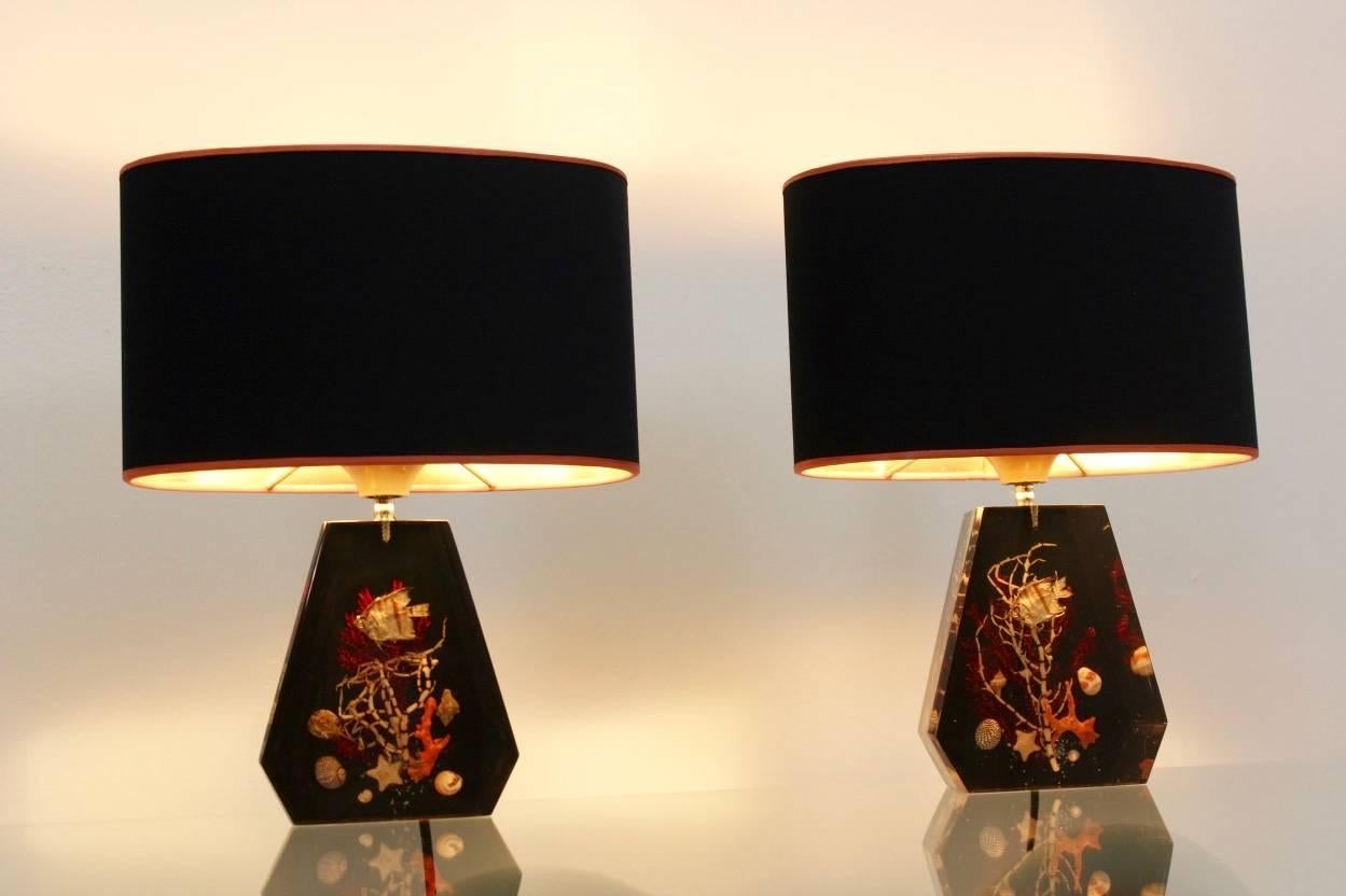 Unique and beautiful pair of sea life midcentury table lamps from the 1970s. The set is made in France and unique and has a sophisticated appearance. The beautiful black shades give a very warm light with the inner side of the shades in gold. The