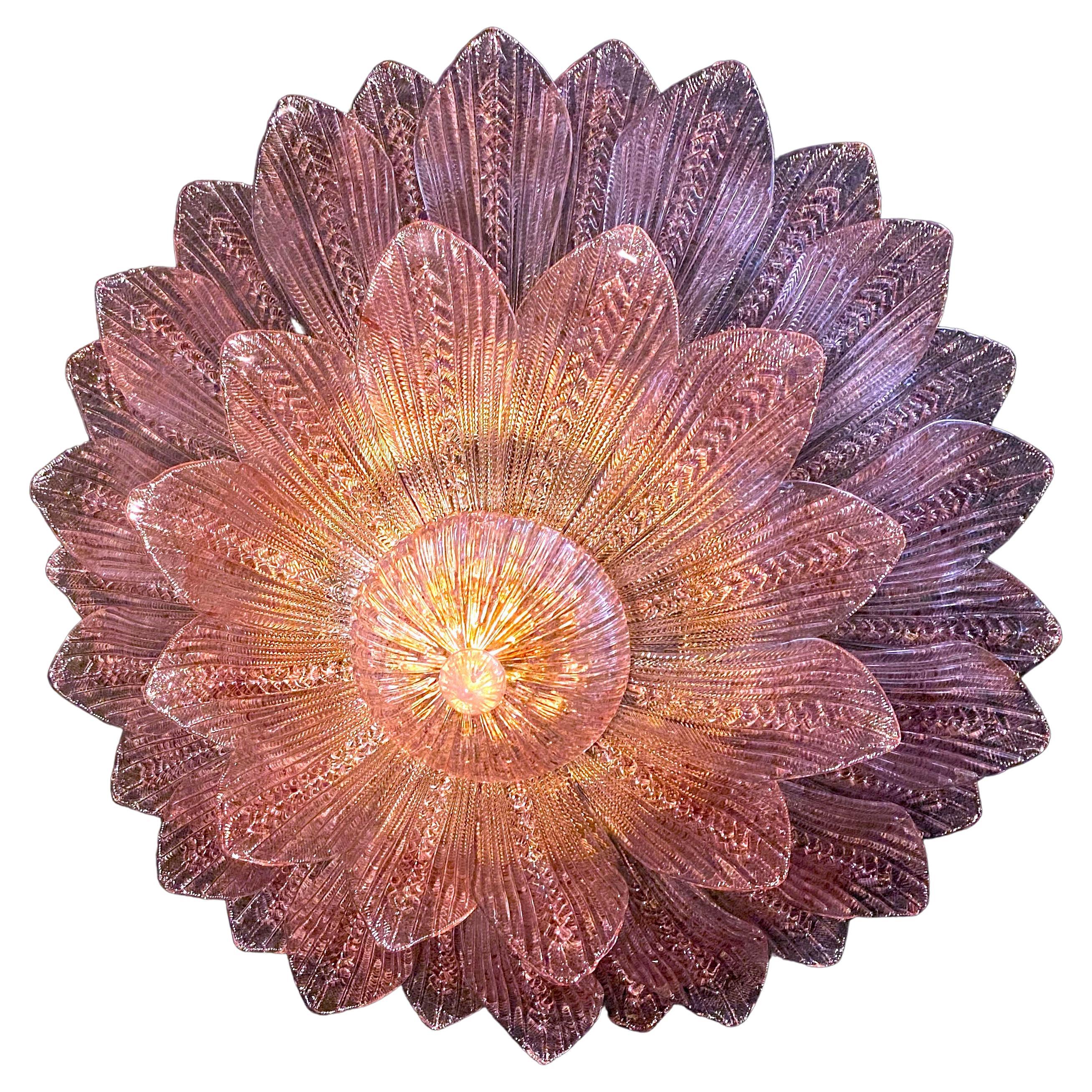 Realized in pure pink amethyst color Murano glass consists of 45 delicious hand-blown leaves.
 The structure is gilt-metal. Five E27 lights spread a magical light.

Available also a pair.
This light fixture can be disassembled and the leaves
