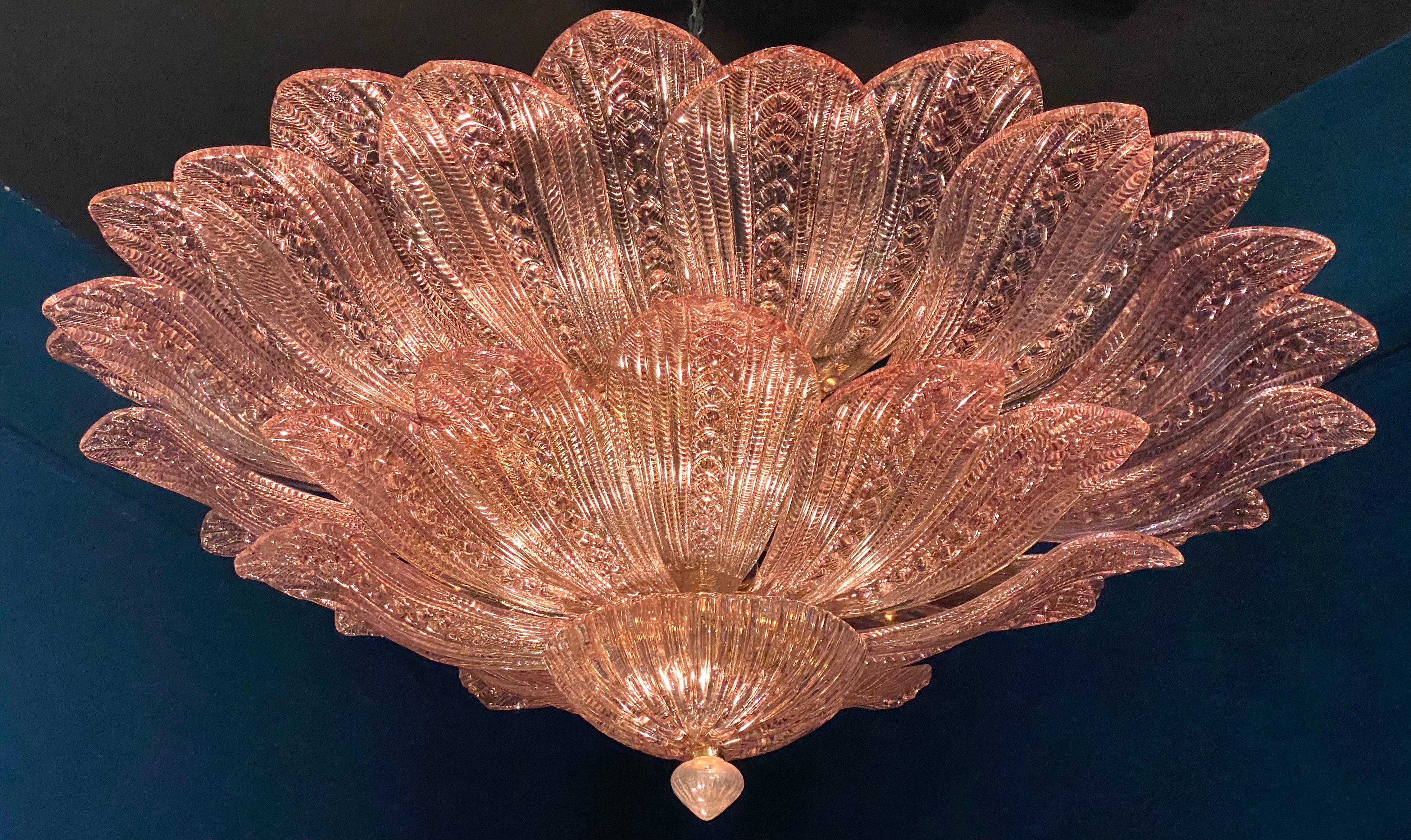 Realized in pure pink amethyst color Murano glass consists of 45 delicious hand-blown leaves.
 The structure is gilt-metal. Five E27 lights spread a magical light.
 the price is item 
Available also a pair.
This light fixture can be disassembled and